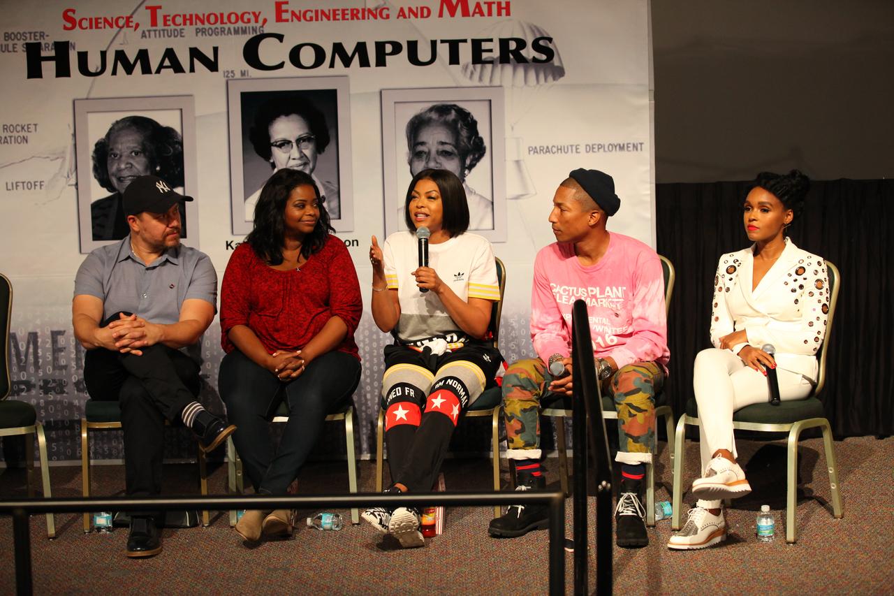 In the IMAX Theater of the Kennedy Space Center Visitor Complex Cast and crew members of the upcoming motion picture "Hidden Figures" participate in a question and answer session. From the left are Ted Melfi, writer and director of “Hidden Figures,” Octavia Spencer, who portrays Dorothy Vaughan in the film, Taraji P. Henson, who portrays Katherine Johnson, Pharrell Williams, musician and producer of “Hidden Figures," and Janelle Monáe, who portrays Mary Jackson. The movie is based on the book of the same title, by Margot Lee Shetterly. It chronicles the lives of Katherine Johnson, Dorothy Vaughan and Mary Jackson, three African-American women who worked for NASA as human "computers.” Their mathematical calculations were crucial to the success of Project Mercury missions including John Glenn’s orbital flight aboard Friendship 7 in 1962. The film is due in theaters in January 2017.