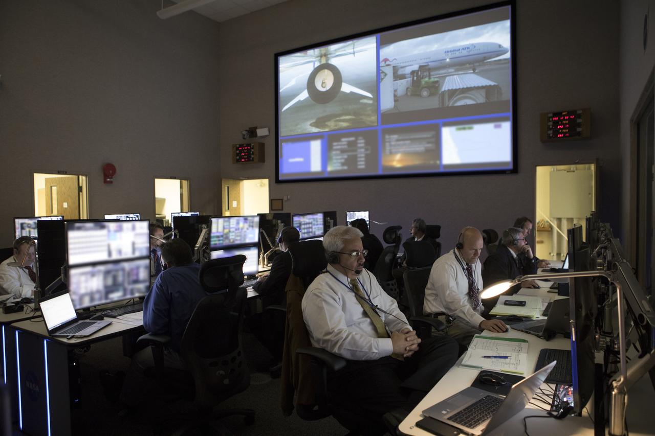 In the Mission Director's Center at Cape Canaveral Air Force Station, members of the launch team monitor the progress of preparations to launch eight Cyclone Global Navigation Satellite System, or CYGNSS, spacecraft. The CYGNSS satellites will make frequent and accurate measurements of ocean surface winds throughout the life cycle of tropical storms and hurricanes. The data that CYGNSS provides will enable scientists to probe key air-sea interaction processes that take place near the core of storms, which are rapidly changing and play a crucial role in the beginning and intensification of hurricanes.