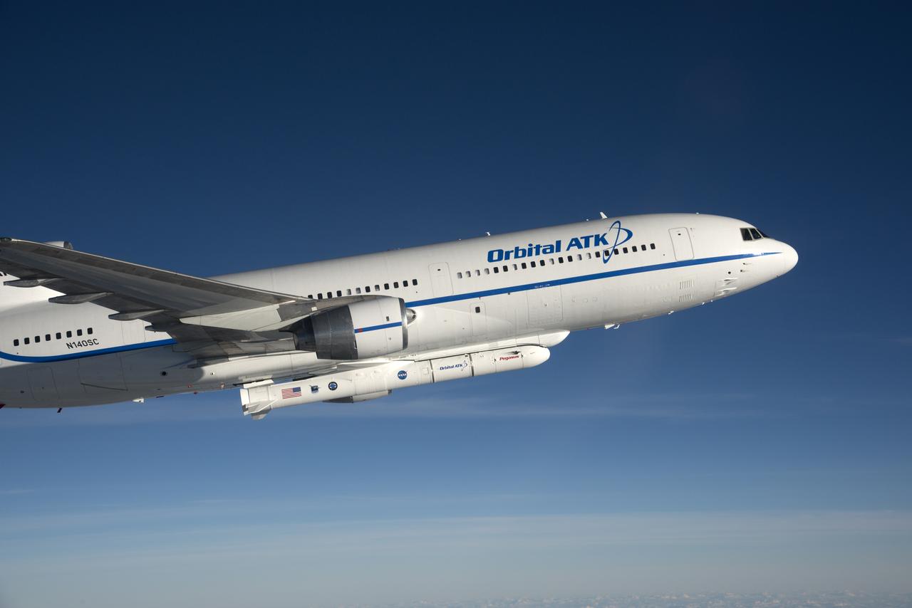 Photographed from the F-18 pathfinder aircraft, the Orbital ATK L-1011 Stargazer aircraft is seen flying over the Atlantic Ocean offshore from Daytona Beach, Florida. Attached beneath the aircraft is the Pegasus XL rocket with eight Cyclone Global Navigation Satellite System, or CYGNSS, spacecraft. The CYGNSS satellites will make frequent and accurate measurements of ocean surface winds throughout the life cycle of tropical storms and hurricanes. The data that CYGNSS provides will enable scientists to probe key air-sea interaction processes that take place near the core of storms, which are rapidly changing and play a crucial role in the beginning and intensification of hurricanes.