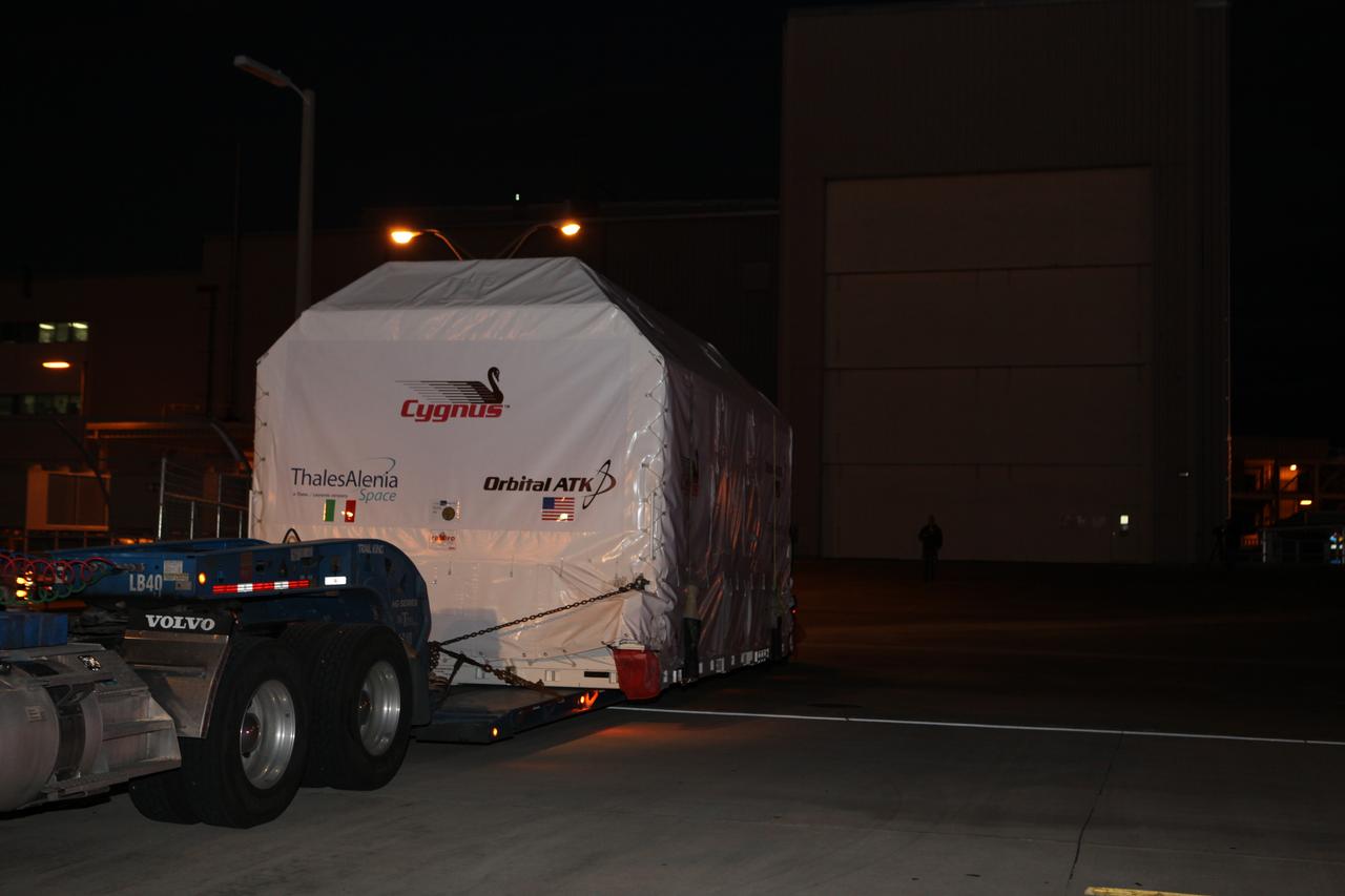 The Orbital ATK OA-7 Cygnus spacecraft's pressurized cargo module (PCM) arrives at the Space Station Processing Facility of NASA's Kennedy Space Center in Florida. The PCM is sealed in an environmentally controlled shipping container, pulled in by truck on a low-boy flatbed trailer. Scheduled to launch in March 2017, the Orbital ATK OA-7 mission will lift off atop a United Launch Alliance Atlas V rocket from Space launch Complex 41 at Cape Canaveral Air Force Station. The commercial resupply services mission to the International Space Station will deliver thousands of pounds of supplies, equipment and scientific research materials that improve life on Earth and drive progress toward future space exploration.