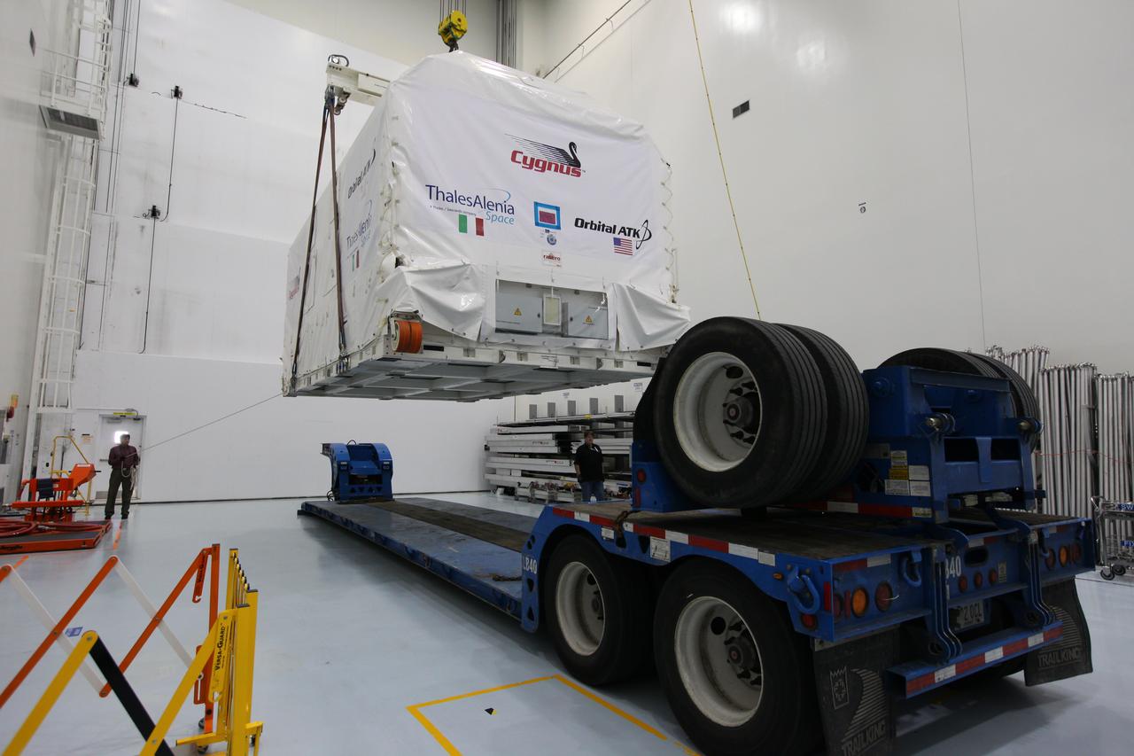 A crane is used to lift the Orbital ATK OA-7 Cygnus spacecraft's pressurized cargo module (PCM) off a flatbed truck after arrival at the Space Station Processing Facility of NASA's Kennedy Space Center in Florida. The PCM is sealed in an environmentally controlled shipping container. Scheduled to launch on March 19, 2017, the Orbital ATK OA-7 mission will lift off atop a United Launch Alliance Atlas V rocket from Space launch Complex 41 at Cape Canaveral Air Force Station. The commercial resupply services mission to the International Space Station will deliver thousands of pounds of supplies, equipment and scientific research materials that improve life on Earth and drive progress toward future space exploration.