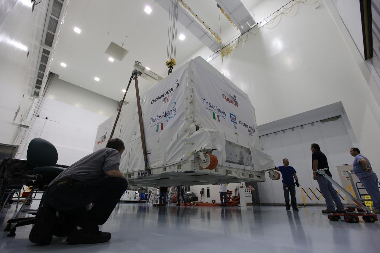 A crane lowers an environmentally controlled shipping container with the Orbital ATK OA-7 Cygnus spacecraft's pressurized cargo module (PCM) inside to the floor of the Space Station Processing Facility of NASA's Kennedy Space Center in Florida. Scheduled to launch on March 19, 2017, the Orbital ATK OA-7 mission will lift off atop a United Launch Alliance Atlas V rocket from Space launch Complex 41 at Cape Canaveral Air Force Station. The commercial resupply services mission to the International Space Station will deliver thousands of pounds of supplies, equipment and scientific research materials that improve life on Earth and drive progress toward future space exploration.