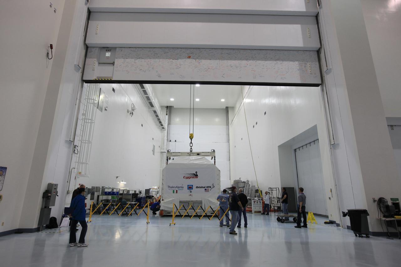Inside an environmentally controlled shipping container the Orbital ATK OA-7 Cygnus spacecraft's pressurized cargo module (PCM) moves from an airlock to the high bay of the Space Station Processing Facility of NASA's Kennedy Space Center in Florida. Scheduled to launch on March 19, 2017, the Orbital ATK OA-7 mission will lift off atop a United Launch Alliance Atlas V rocket from Space launch Complex 41 at Cape Canaveral Air Force Station. The commercial resupply services mission to the International Space Station will deliver thousands of pounds of supplies, equipment and scientific research materials that improve life on Earth and drive progress toward future space exploration.