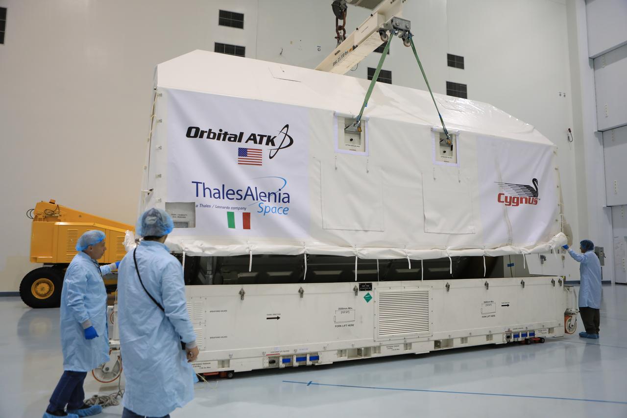 Inside the high bay of the Space Station Processing Facility of NASA's Kennedy Space Center in Florida engineers and technicians remove the Orbital ATK OA-7 Cygnus spacecraft's pressurized cargo module (PCM) from its environmentally controlled shipping container. Scheduled to launch on March 19, 2017, the Orbital ATK OA-7 mission will lift off atop a United Launch Alliance Atlas V rocket from Space launch Complex 41 at Cape Canaveral Air Force Station. The commercial resupply services mission to the International Space Station will deliver thousands of pounds of supplies, equipment and scientific research materials that improve life on Earth and drive progress toward future space exploration.
