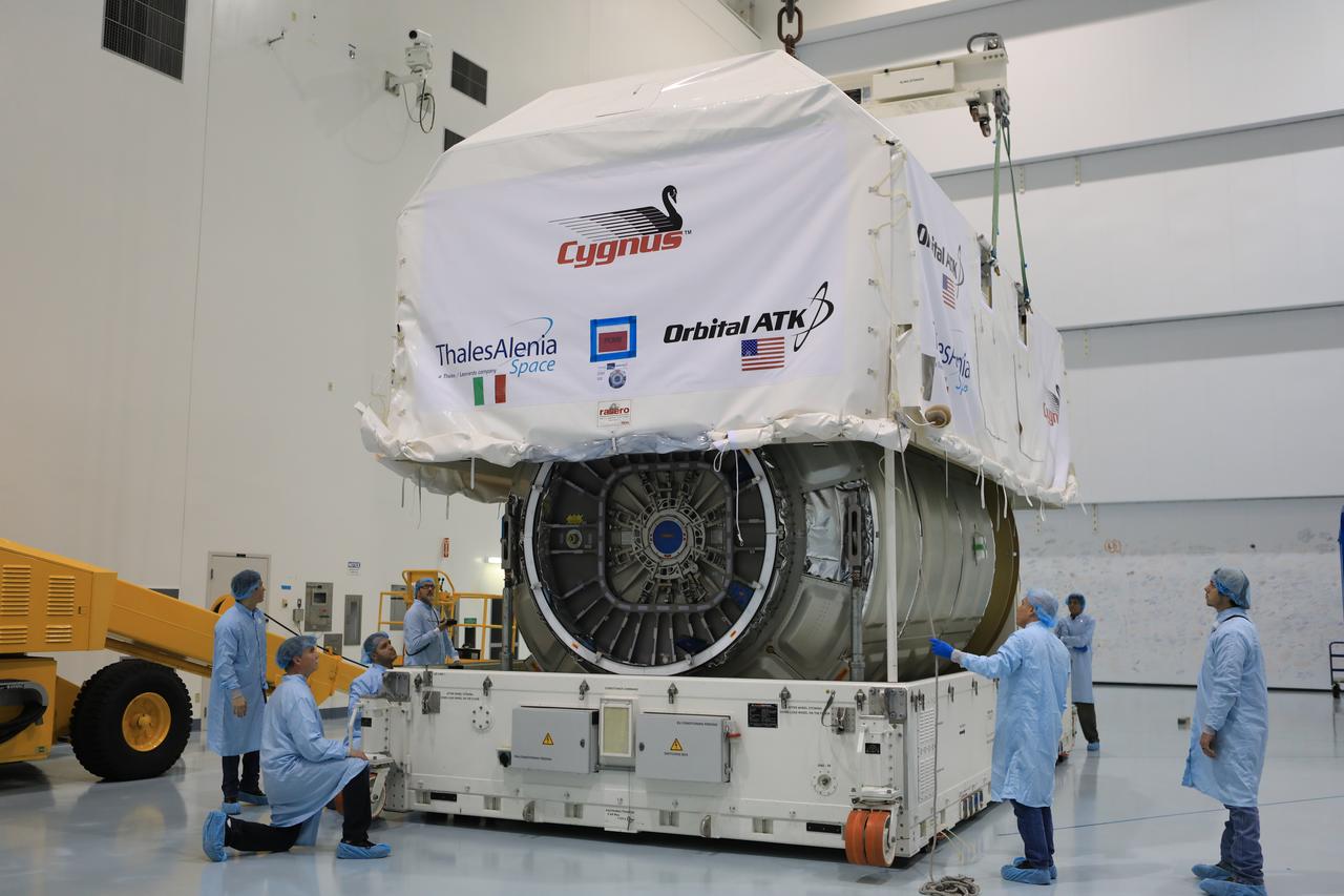 Inside the high bay of the Space Station Processing Facility of NASA's Kennedy Space Center in Florida engineers and technicians remove the Orbital ATK OA-7 Cygnus spacecraft's pressurized cargo module (PCM) from its environmentally controlled shipping container. Scheduled to launch on March 19, 2017, the Orbital ATK OA-7 mission will lift off atop a United Launch Alliance Atlas V rocket from Space launch Complex 41 at Cape Canaveral Air Force Station. The commercial resupply services mission to the International Space Station will deliver thousands of pounds of supplies, equipment and scientific research materials that improve life on Earth and drive progress toward future space exploration.