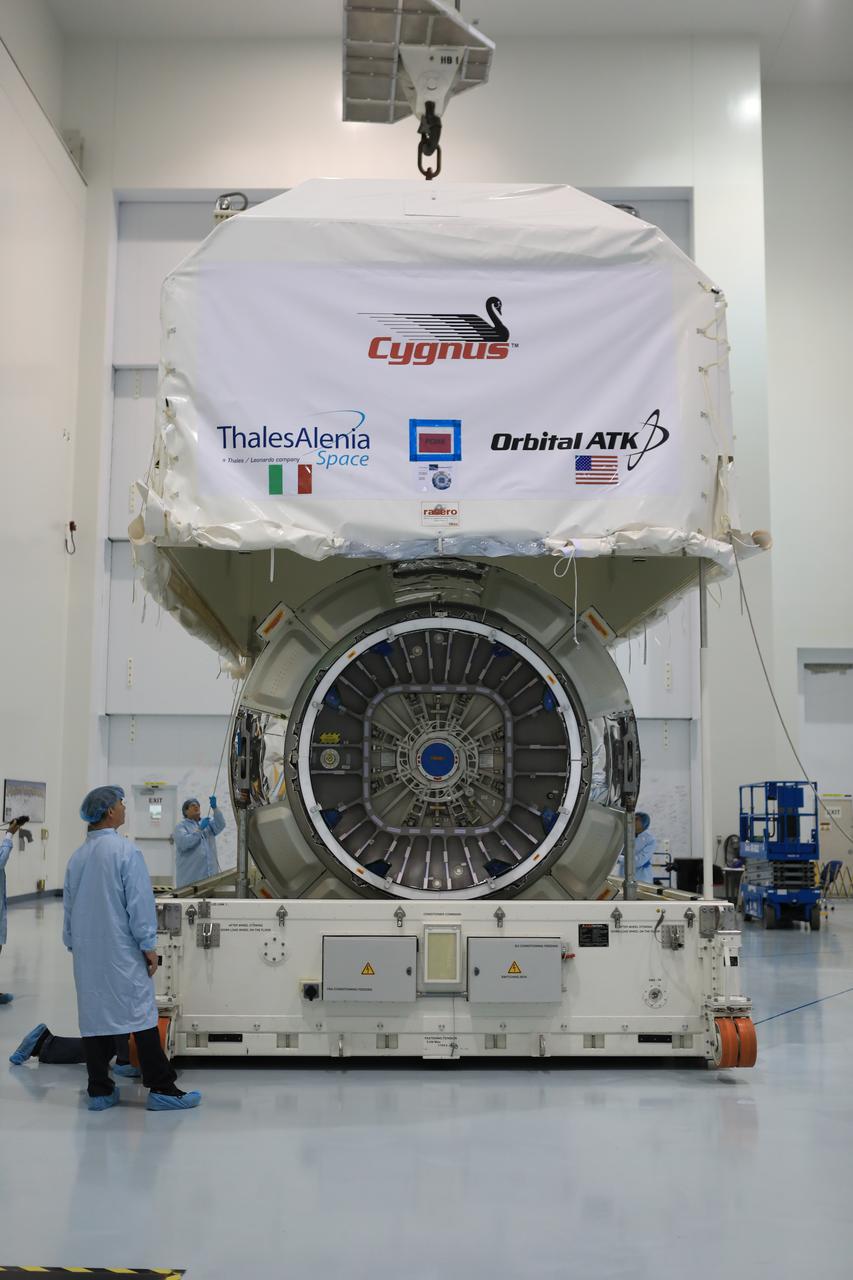 Inside the high bay of the Space Station Processing Facility of NASA's Kennedy Space Center in Florida engineers and technicians remove the Orbital ATK OA-7 Cygnus spacecraft's pressurized cargo module (PCM) from its environmentally controlled shipping container. Scheduled to launch on March 19, 2017, the Orbital ATK OA-7 mission will lift off atop a United Launch Alliance Atlas V rocket from Space launch Complex 41 at Cape Canaveral Air Force Station. The commercial resupply services mission to the International Space Station will deliver thousands of pounds of supplies, equipment and scientific research materials that improve life on Earth and drive progress toward future space exploration.