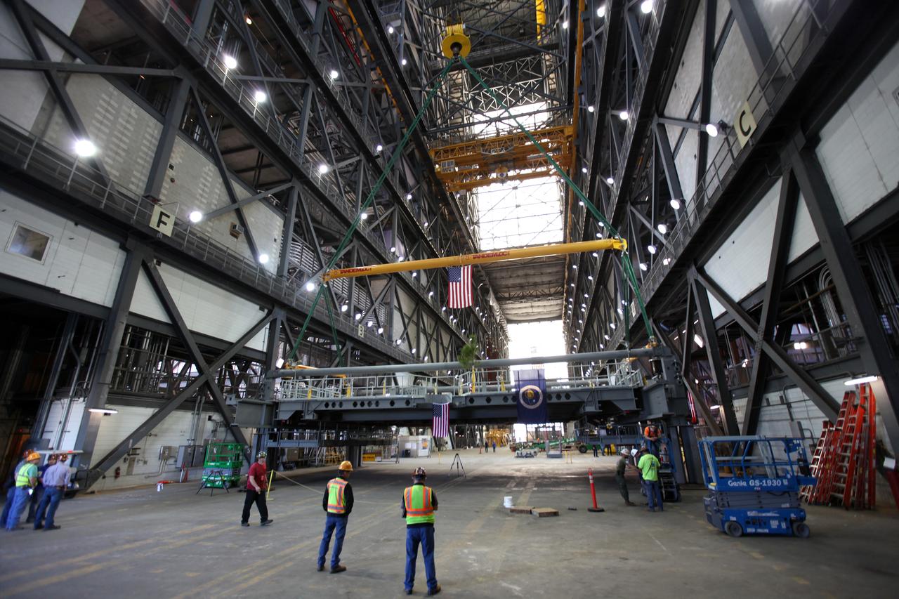 Preparations are underway to lift the final work platform, A north, up from the transfer aisle in the Vehicle Assembly Building (VAB) at NASA's Kennedy Space Center in Florida. The platform will be installed and secured on its rail beam high up on the north wall of High Bay 3. The installation of the final topmost level completes the 10 levels of work platforms, 20 platform halves altogether, that will surround NASA's Space Launch System rocket and the Orion spacecraft and allow access during processing for missions, including the first uncrewed flight test of Orion atop the SLS rocket in 2018. The A-level platforms will provide access to the Orion spacecraft's Launch Abort System for Orion lifting sling removal and installation of the closeout panels. The Ground Systems Development and Operations Program, with support from the center's Engineering Directorate, is overseeing upgrades and modifications to the VAB, including installation of the new work platforms.