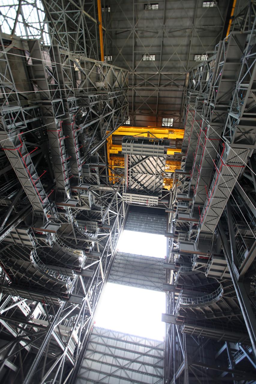 High up in the Vehicle Assembly Building (VAB) at NASA's Kennedy Space Center in Florida, a crane lowers the final work platform, A north, for installation in High Bay 3. The platform will be installed and secured on its rail beam high up on the north wall of the high bay. The installation of the final topmost level completes the 10 levels of work platforms, 20 platform halves altogether, that will surround NASA's Space Launch System rocket and the Orion spacecraft and allow access during processing for missions, including the first uncrewed flight test of Orion atop the SLS rocket in 2018. The A-level platforms will provide access to the Orion spacecraft's Launch Abort System for Orion lifting sling removal and installation of the closeout panels. The Ground Systems Development and Operations Program, with support from the center's Engineering Directorate, is overseeing upgrades and modifications to the VAB, including installation of the new work platforms. 