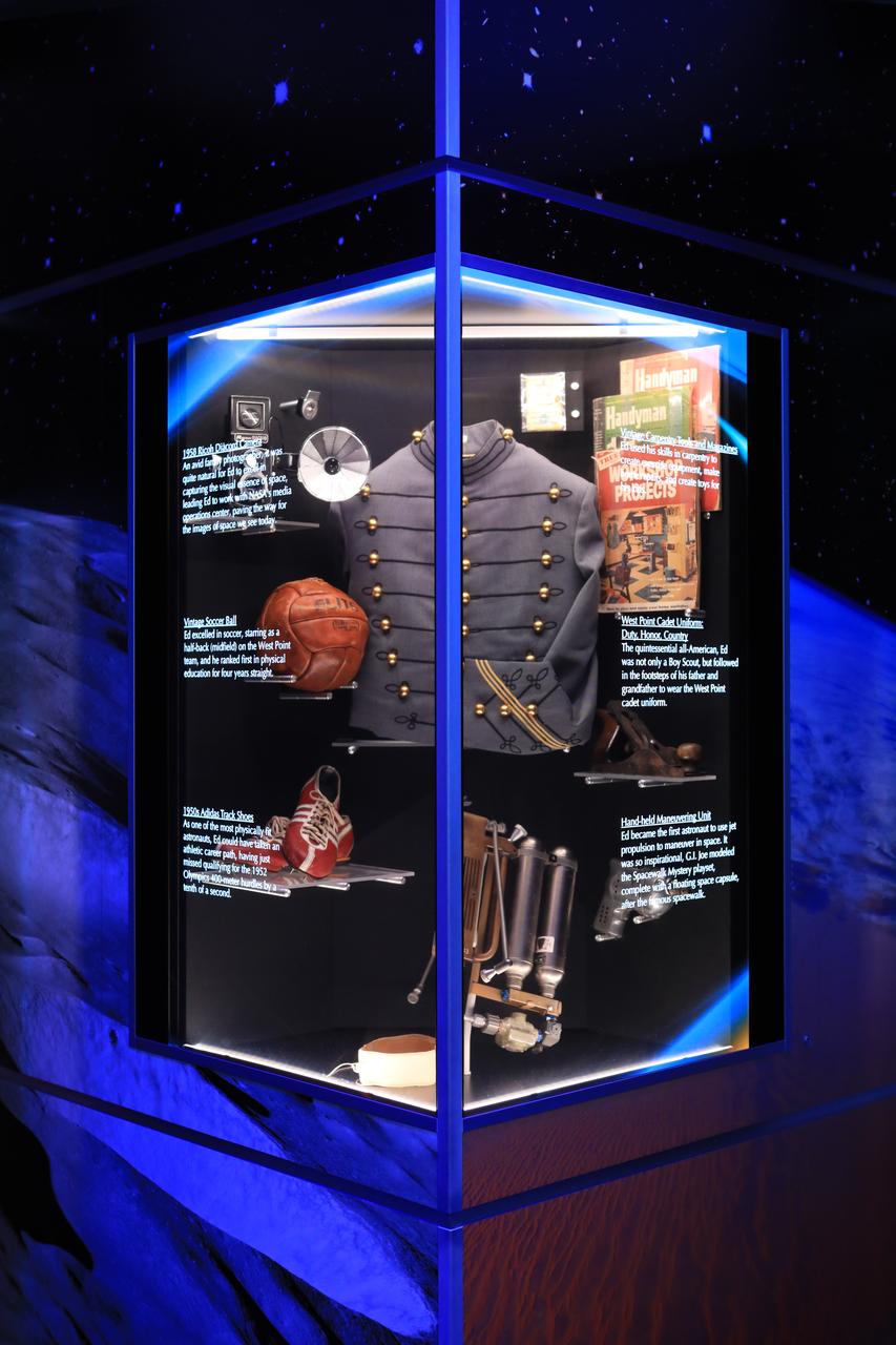 A display case dedicated to astronaut Ed White II is shown inside the new tribute to the crew of Apollo 1 who perished in a fire at the launch pad on Jan. 27, 1967, during training for the mission. Gus Grissom, White and Roger Chaffee were lost during the fire. The tribute at the Apollo/Saturn V Center at NASA's Kennedy Space Center opened Jan. 27, 2017, 50 years after the crew of three was lost. It features numerous items recalling the lives of the three astronauts. It also includes the three-part hatch to the spacecraft itself, the first time any part of the Apollo 1 spacecraft has been displayed publicly. A version of the hatch after it was redesigned is also showcased as an example of improvements NASA made throughout the agency and to the Apollo spacecraft that would later carry astronauts to the moon.