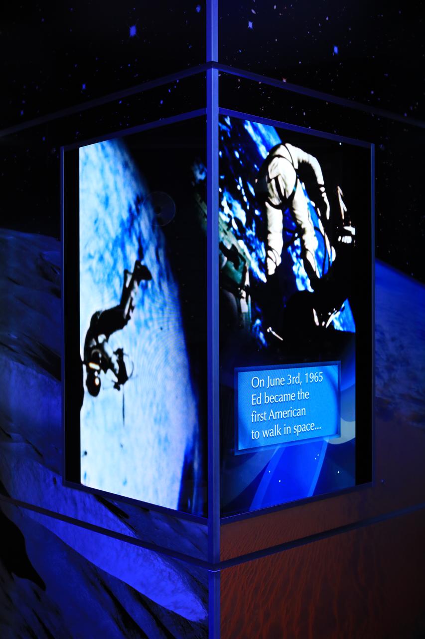 A display case dedicated to astronaut Ed White II is shown inside the new tribute to the crew of Apollo 1 who perished in a fire at the launch pad on Jan. 27, 1967, during training for the mission. Gus Grissom, White and Roger Chaffee were lost during the fire. The tribute at the Apollo/Saturn V Center at NASA's Kennedy Space Center opened Jan. 27, 2017, 50 years after the crew of three was lost. It features numerous items recalling the lives of the three astronauts. It also includes the three-part hatch to the spacecraft itself, the first time any part of the Apollo 1 spacecraft has been displayed publicly. A version of the hatch after it was redesigned is also showcased as an example of improvements NASA made throughout the agency and to the Apollo spacecraft that would later carry astronauts to the moon.