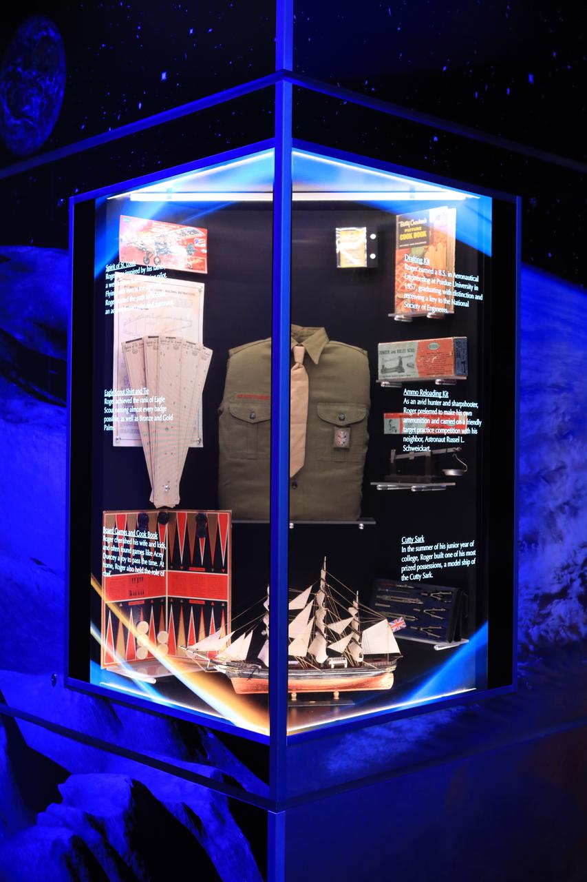 A display case dedicated to astronaut Roger Chaffee is shown inside the new tribute to the crew of Apollo 1 who perished in a fire at the launch pad on Jan. 27, 1967, during training for the mission. Gus Grissom, Ed White II and Chaffee were lost during the fire. The tribute at the Apollo/Saturn V Center at NASA's Kennedy Space Center opened Jan. 27, 2017, 50 years after the crew of three was lost. It features numerous items recalling the lives of the three astronauts. It also includes the three-part hatch to the spacecraft itself, the first time any part of the Apollo 1 spacecraft has been displayed publicly. A version of the hatch after it was redesigned is also showcased as an example of improvements NASA made throughout the agency and to the Apollo spacecraft that would later carry astronauts to the moon.