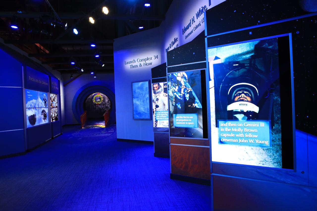 The new tribute to the crew of Apollo 1 who perished in a fire at the launch pad on Jan. 27, 1967, during training for the mission is shown looking down the length of the area. The tribute highlights the lives and careers of astronauts Gus Grissom, Ed White II and Roger Chaffee who were lost during the fire. The tribute at the Apollo/Saturn V Center at NASA's Kennedy Space Center opened Jan. 27, 2017, 50 years after the crew of three was lost. It features numerous items recalling the lives of the three astronauts. The tribute also includes the three-part hatch to the spacecraft itself, the first time any part of the Apollo 1 spacecraft has been displayed publicly. A version of the hatch after it was redesigned is also showcased as an example of improvements NASA made throughout the agency and to the Apollo spacecraft that would later carry astronauts to the moon.