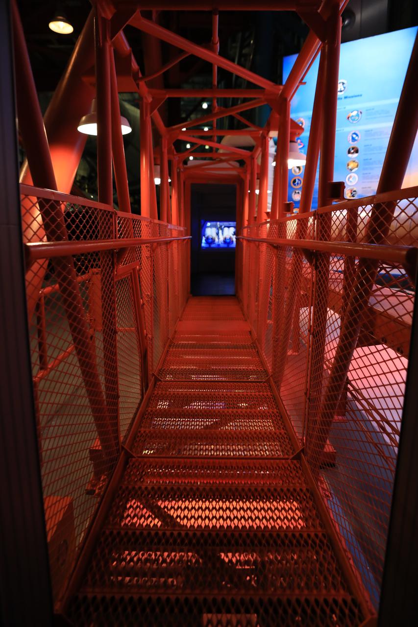 The crew access arm that astronauts walked across to reach the Apollo spacecraft for missions to the moon serves as the exit for the new tribute to the crew of Apollo 1 who perished in a fire at the launch pad on Jan. 27, 1967, during training for the mission. The tribute highlights the lives and careers of astronauts Gus Grissom, Ed White II and Roger Chaffee who were lost during the fire. The tribute at the Apollo/Saturn V Center at NASA's Kennedy Space Center opened Jan. 27, 2017, 50 years after the crew of three was lost. It features numerous items recalling the lives of the three astronauts. The tribute also includes the three-part hatch to the spacecraft itself, the first time any part of the Apollo 1 spacecraft has been displayed publicly. A version of the hatch after it was redesigned is also showcased as an example of improvements NASA made throughout the agency and to the Apollo spacecraft that would later carry astronauts to the moon. 