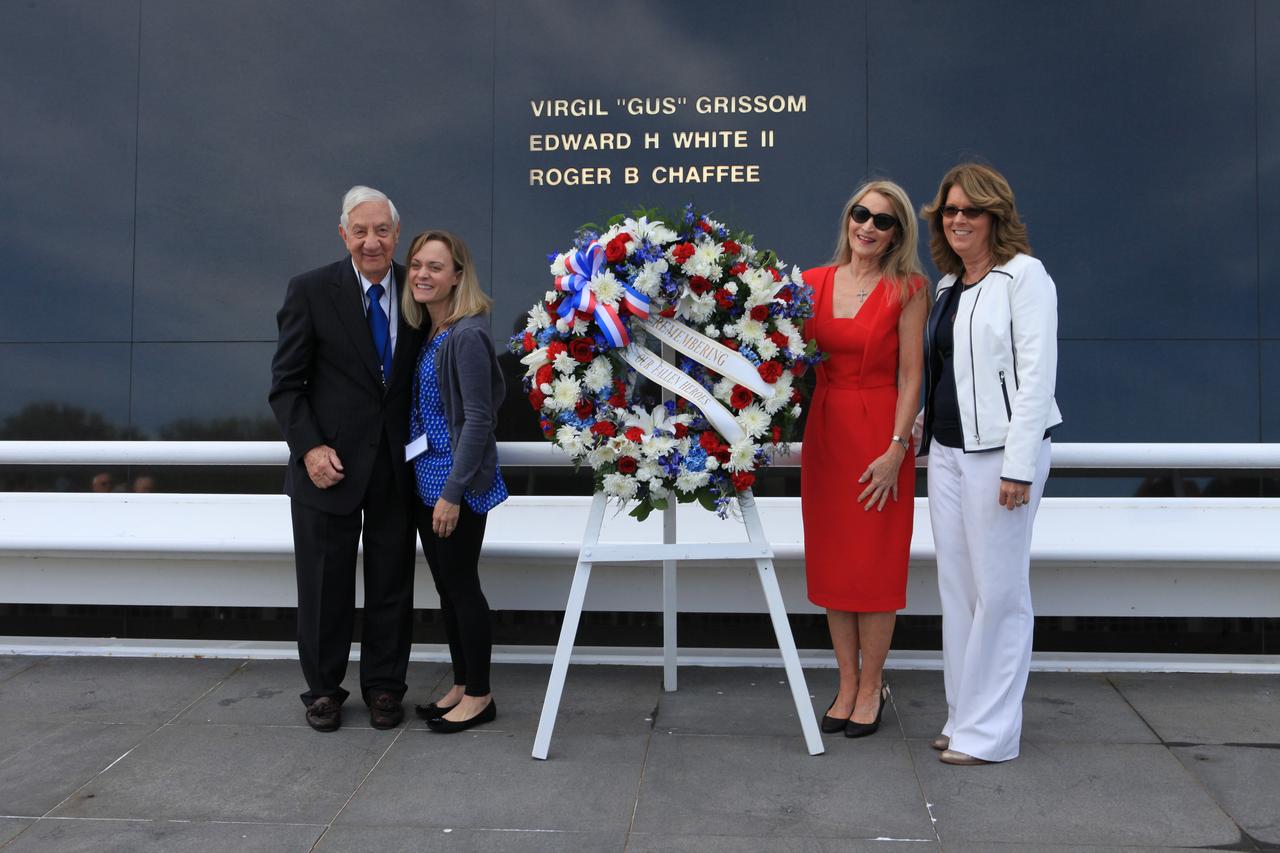 Family members of fallen Apollo 1 astronauts gather beside a wreath placed at the Space Mirror Memorial following Kennedy Space Center's Day of Remembrance ceremony at the Kennedy visitor complex. From left to right are Lowell Grissom, brother of astronaut Gus Grissom; Carly Sparks, granddaughter of Grissom; Bonnie White Baer, daughter of astronaut Ed White II; and Sheryl Chaffee, daughter of Roger Chaffee. 