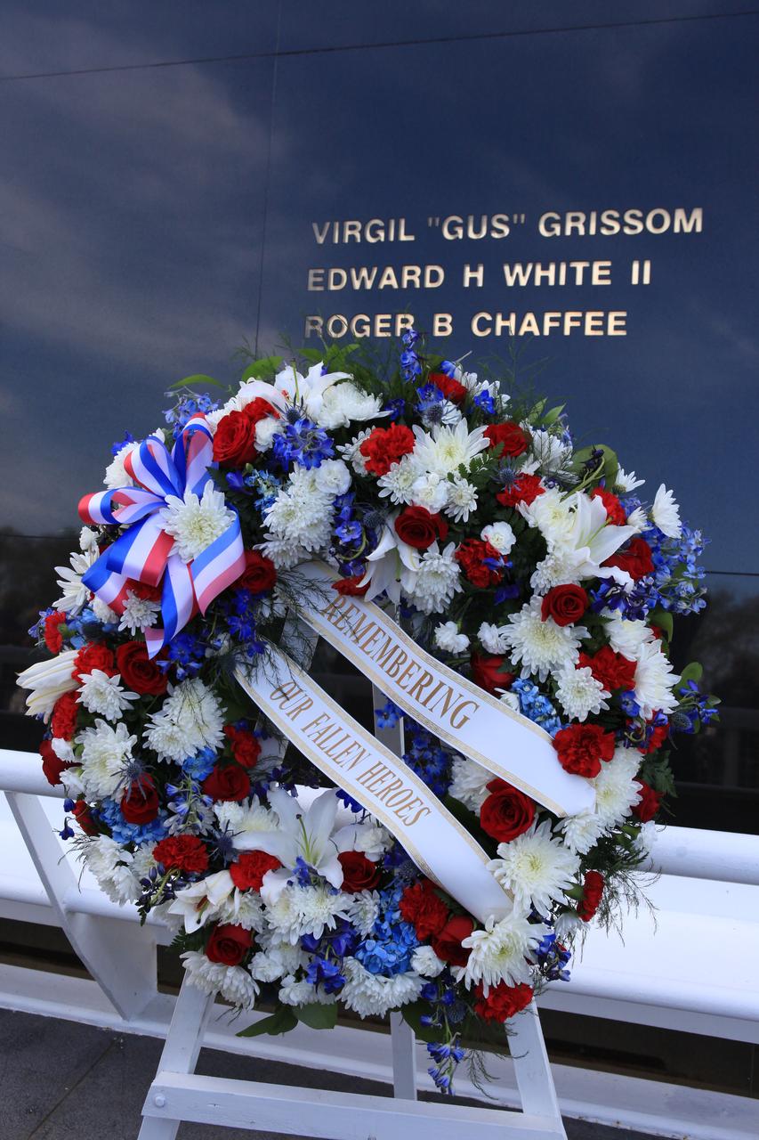 Following the Kennedy Space Center's NASA Day of Remembrance ceremony, Family members of fallen astronauts placed a wreath at the Space Mirror Memorial. The monument includes the names of the fallen astronauts from Apollo 1, Challenger and Columbia, as well as the astronauts who perished in training and commercial airplane accidents are emblazoned on the monument's 45-foot-high-by-50-foot-wide polished black granite surface.
