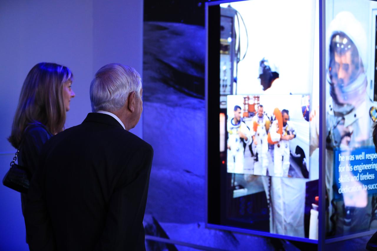 Lowell Grissom, brother of Gus Grissom, and Carly Sparks, granddaughter of Grissom, look at areas of the newly opened Apollo 1 tribute at the Apollo/Saturn V Center at NASA's Kennedy Space Center opened Jan. 27, 2017. Astronauts Gus Grissom, Ed White II and Chaffee perished in a fire at the launch pad on Jan. 27, 1967, during training for the mission. The tribute highlights the lives and careers of the astronauts. The tribute features numerous items recalling the lives of the three astronauts. The tribute also includes the three-part hatch to the spacecraft itself, the first time any part of the Apollo 1 spacecraft has been displayed publicly. A version of the hatch after it was redesigned is also showcased as an example of improvements NASA made throughout the agency and to the Apollo spacecraft that would later carry astronauts to the moon.