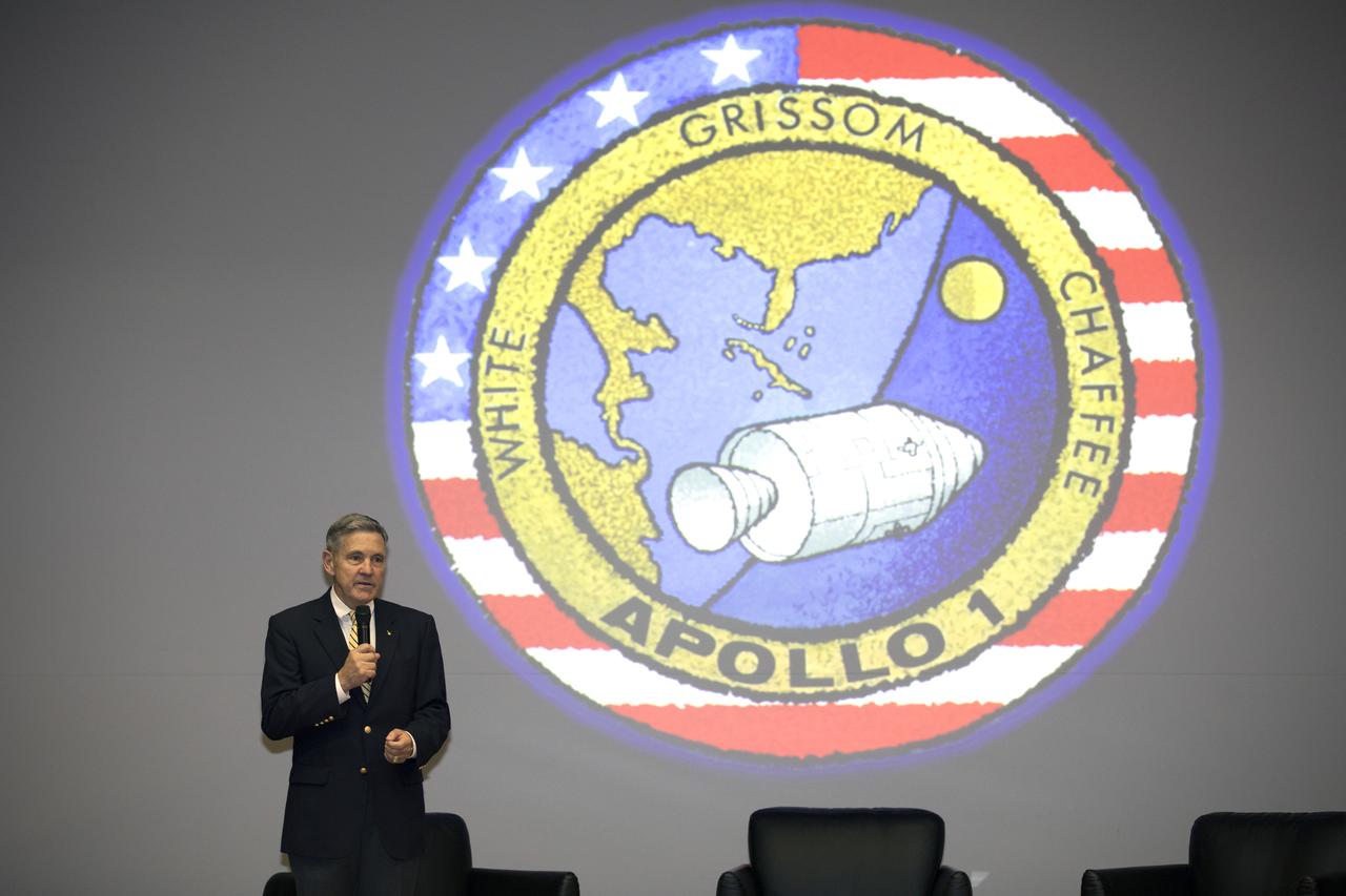 Kennedy Space Center Director Bob Cabana welcomes participants to the Apollo 1 Lessons Learned presentation in the Training Auditorium at NASA’s Kennedy Space Center in Florida. The program's theme was "To There and Back Again." Guest panelists included Charlie Duke, former Apollo 16 astronaut and member of the Apollo 1 Emergency Egress Investigation Team; Ernie Reyes, retired, Apollo 1 senior operations engineer; and John Tribe, retired, Apollo 1 Reaction and Control System lead engineer. The event helped pay tribute to the Apollo 1 crew, Gus Grissom, Ed White II, and Roger Chaffee.