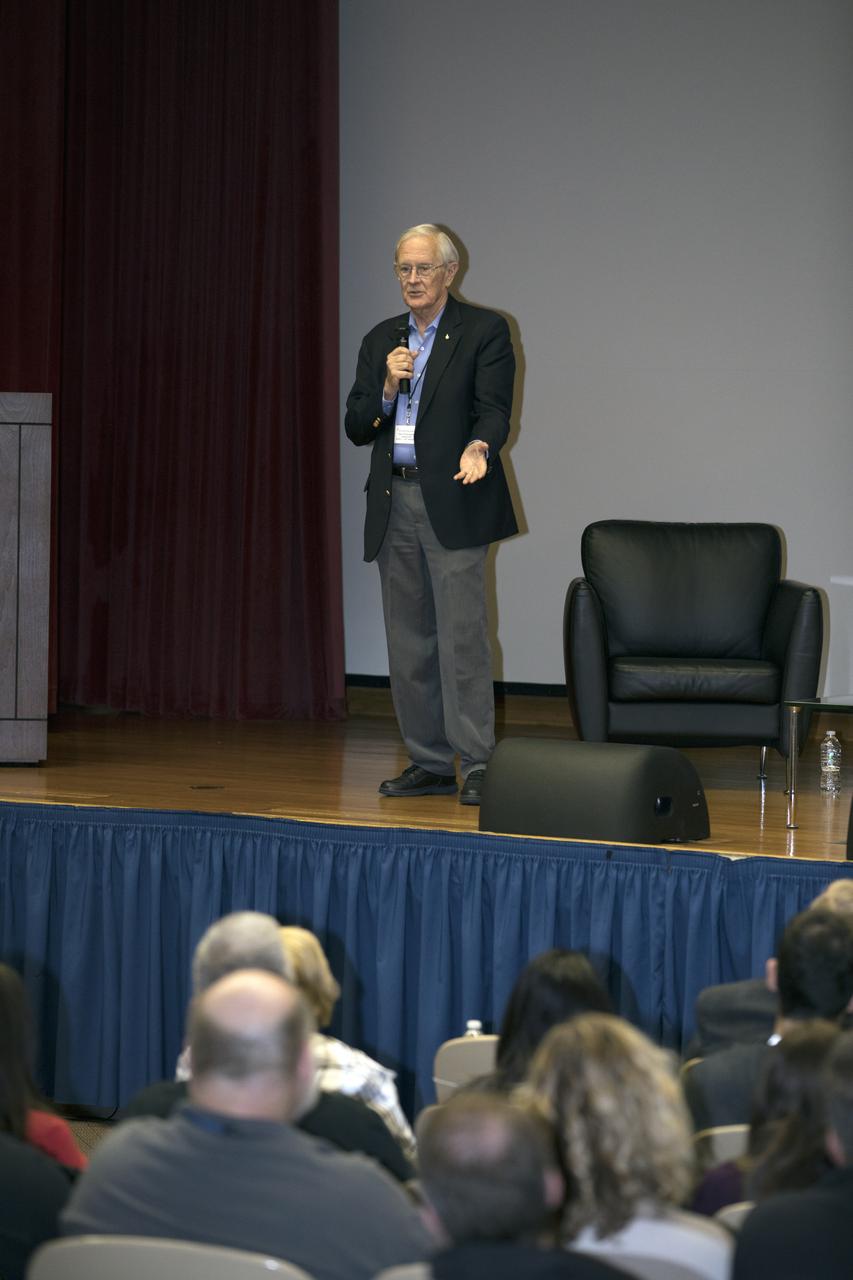 Charlie Duke, former Apollo 16 astronaut and member of the Apollo 1 Emergency Egress Investigation Team, speaks to participants during the Apollo 1 Lessons Learned presentation in the Training Auditorium at NASA's Kennedy Space Center in Florida. The program's theme was "To There and Back Again." Other guest panelists included Ernie Reyes, retired, Apollo 1 senior operations engineer; and John Tribe, retired, Apollo 1 Reaction and Control System lead engineer. The event helped pay tribute to the Apollo 1 crew, Gus Grissom, Ed White II, and Roger Chaffee.