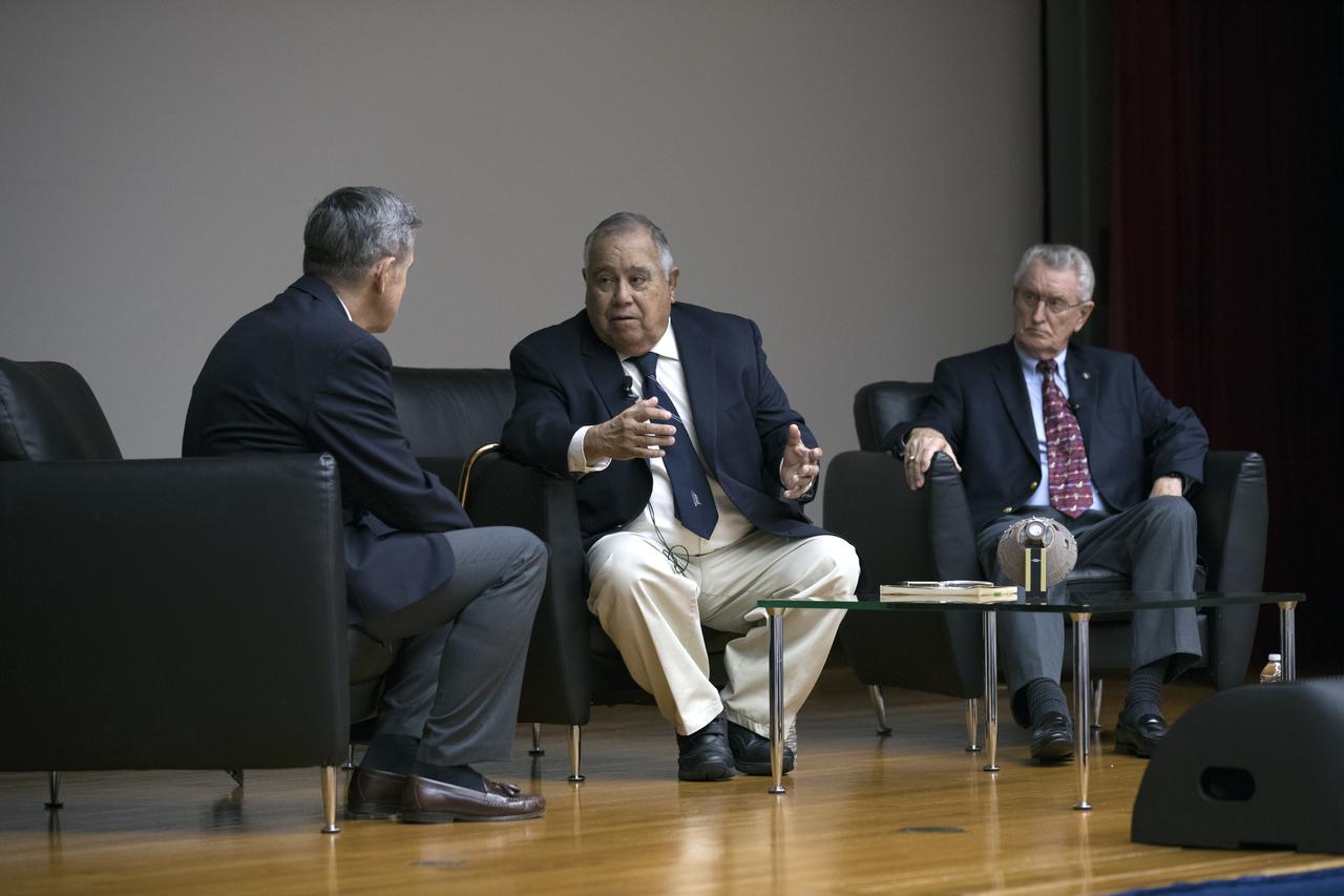 NASA Kennedy Space Center Director Bob Cabana, at left, moderates a panel discussion during the Apollo 1 Lessons Learned event in the Training Auditorium at NASA’s Kennedy Space Center in Florida. The theme of the presentation was "To There and Back Again." Answering questions are Ernie Reyes, retired, Apollo 1 senior operations engineer; and John Tribe, retired, Apollo 1 Reaction and Control System lead engineer. The event helped pay tribute to the Apollo 1 crew, Gus Grissom, Ed White II, and Roger Chaffee.
