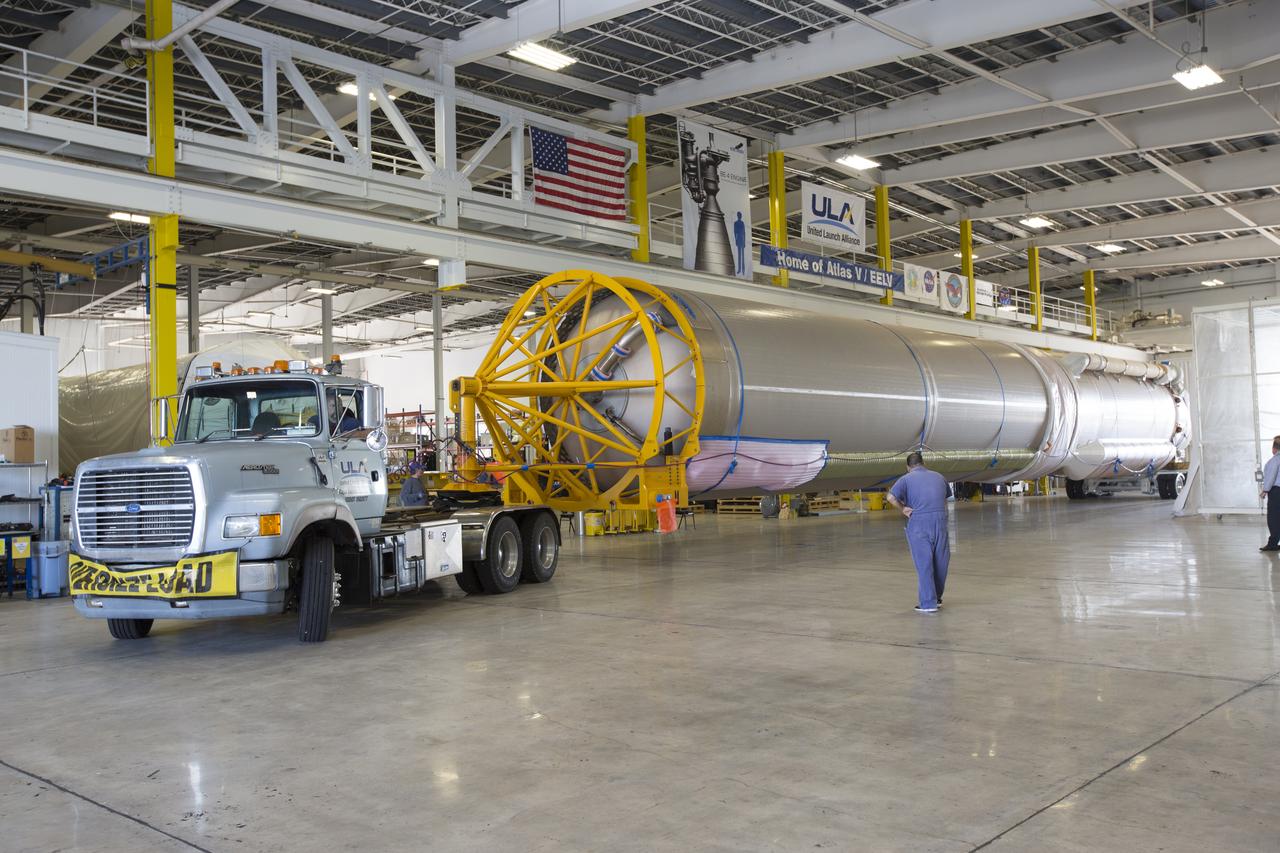 A United Launch Alliance (ULA) Atlas V booster arrives at Cape Canaveral Air Force Station's Atlas Spaceflight Operations Center (ASOC). The Atlas V will undergo final testing in that facility. When processing in the ASOC is complete, the Atlas booster will be moved to the Vertical Integration Facility for stacking at Space Launch Complex 41. Scheduled to launch March 19, 2017, the Atlas will launch a Cygnus spacecraft on the Orbital ATK CRS-7 mission to deliver thousands of pounds of supplies, equipment and scientific research materials to the International Space Station.
