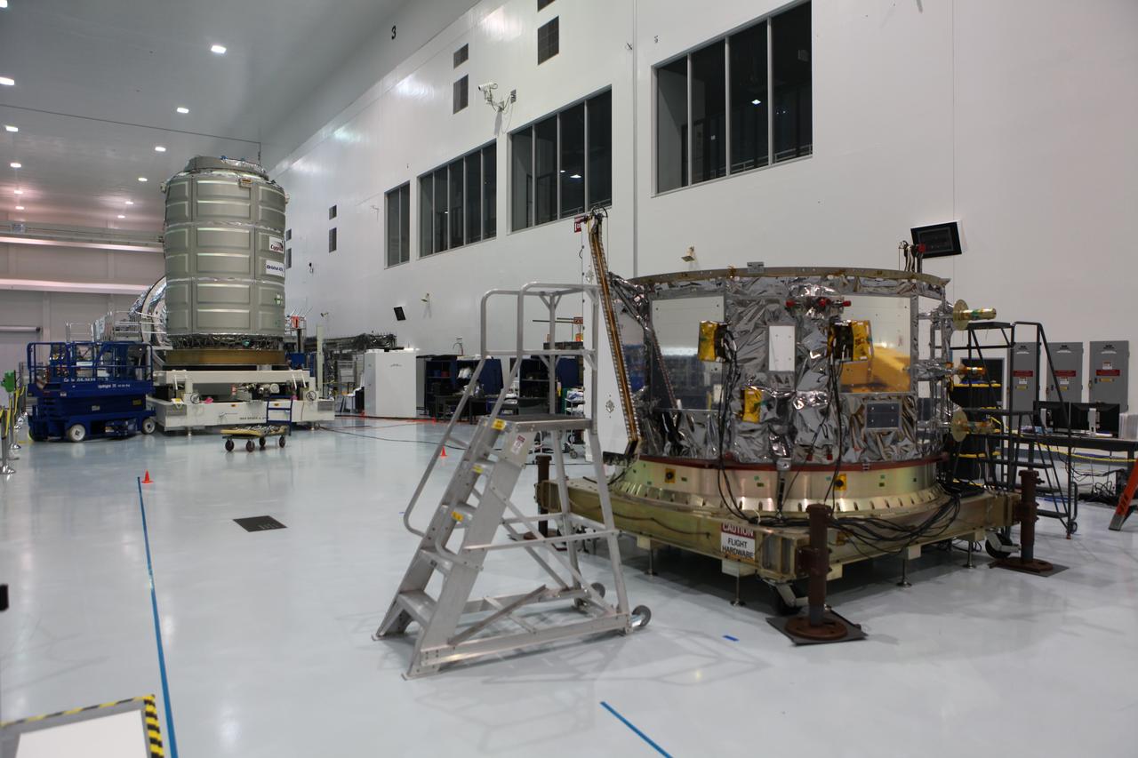 In the Space Station Processing Facility at NASA's Kennedy Space Center in Florida, a Cygnus spacecraft's pressurized cargo module (background) and its service module (foreground) are being prepared for mating for the Orbital ATK CRS-7 mission to the International Space Station. Cygnus is being prepared to deliver thousands of pounds of supplies, equipment and scientific research materials on the Scheduled to launch on March 19, 2017, the commercial resupply services mission will lift off atop a United Launch Alliance Atlas V rocket from Space launch Complex 41 at Cape Canaveral Air Force Station.