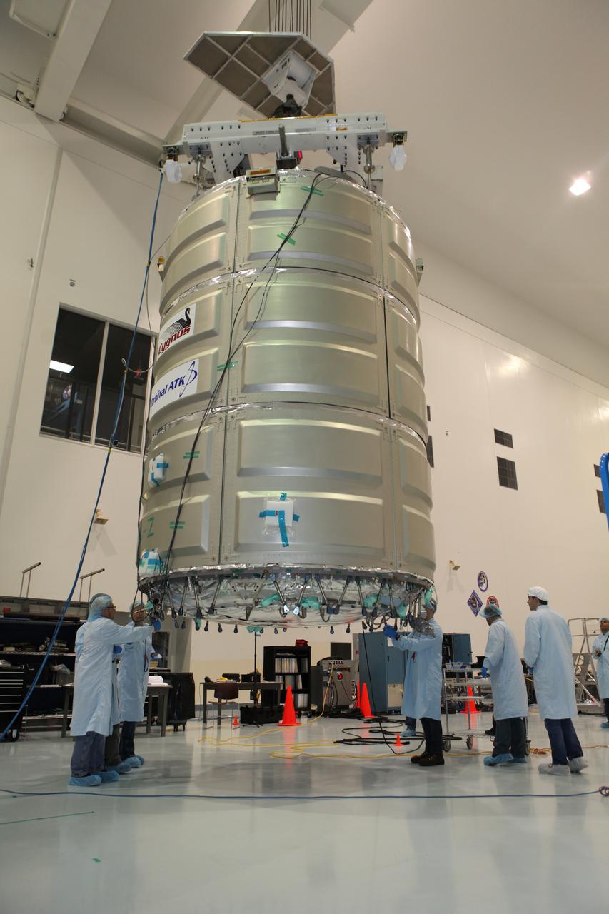 In the Space Station Processing Facility at NASA's Kennedy Space Center in Florida, technicians and engineers use a crane to move a Cygnus spacecraft's pressurized cargo module for mating to its service module. Cygnus is being prepared to deliver thousands of pounds of supplies, equipment and scientific research materials on the Orbital ATK CRS-7 mission to the International Space Station. Scheduled to launch on March 19, 2017, the commercial resupply services mission will lift off atop a United Launch Alliance Atlas V rocket from Space launch Complex 41 at Cape Canaveral Air Force Station.