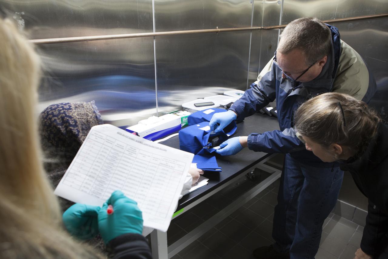 APEX-04, or Advanced Plant EXperiments-04, is being prepared in a cold room in the Kennedy Space Center Processing Facility for SpaceX-10. Shawn Stephens, Engineering Services Contract, and Dr. Anna Lisa Paul confirm proper orientation of the plates for launch prior to turnover to cold stowage. Dr. Paul of the University of Florida is the principal investigator for APEX-04. Apex-04 is an experiment involving Arabidopsis in petri plates inside the Veggie facility aboard the International Space Station. Since Arabidopsis is the genetic model of the plant world, it is a perfect sample organism for performing genetic studies in spaceflight. The experiment is the result of a grant from NASA’s Space Life and Physical Sciences division.