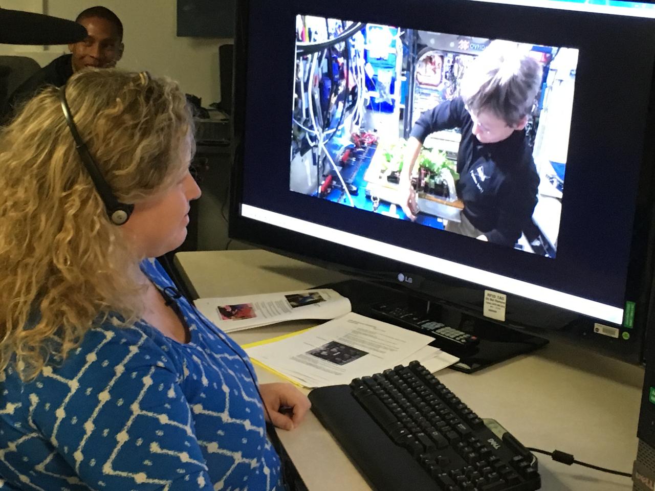 At Kennedy Space Center in Florida, Veggie Project Manager Nicole Dufour instructs astronaut Peggy Whitson during the harvest of Chinese cabbage aboard the International Space Station. While the space station crew will get to eat some of the Chinese cabbage, the rest is being saved for scientific study back at Kennedy Space Center. This is the fifth crop grown aboard the station, and the first Chinese cabbage.