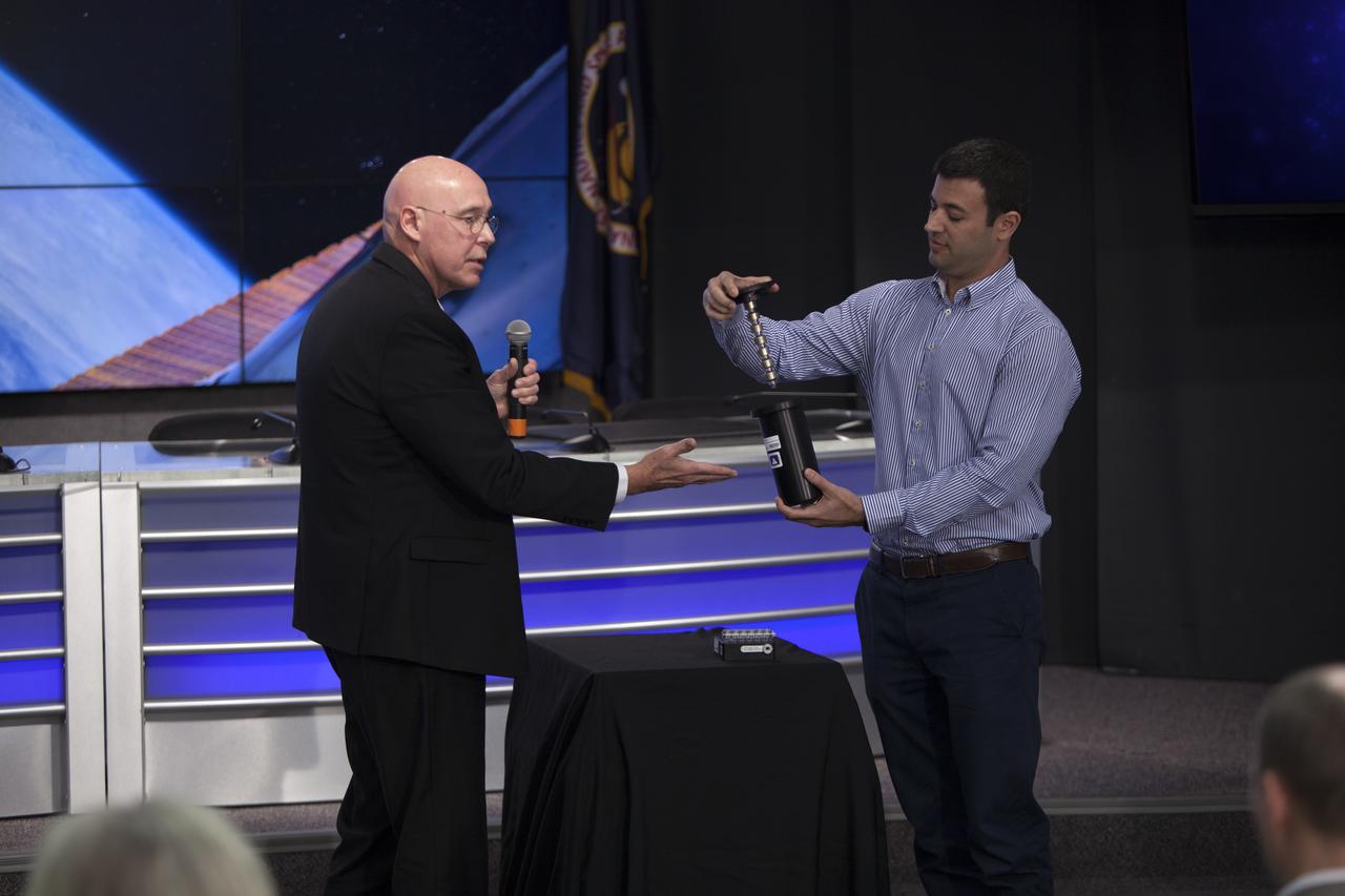 Paul Reichert, associate principal scientist at Merck Research Laboratories in Kenilworth, New Jersey, left, speaks to members of social media in the Kennedy Space Center’s Press Site auditorium. The briefing focused on growth of crystals in microgravity planned for the International Space Station following the arrival of a Dragon spacecraft. The Dragon is scheduled to be launched from Kennedy’s Launch Complex 39A on Feb. 18 atop a SpaceX Falcon 9 rocket on the company's 10th Commercial Resupply Services mission to the space station.
