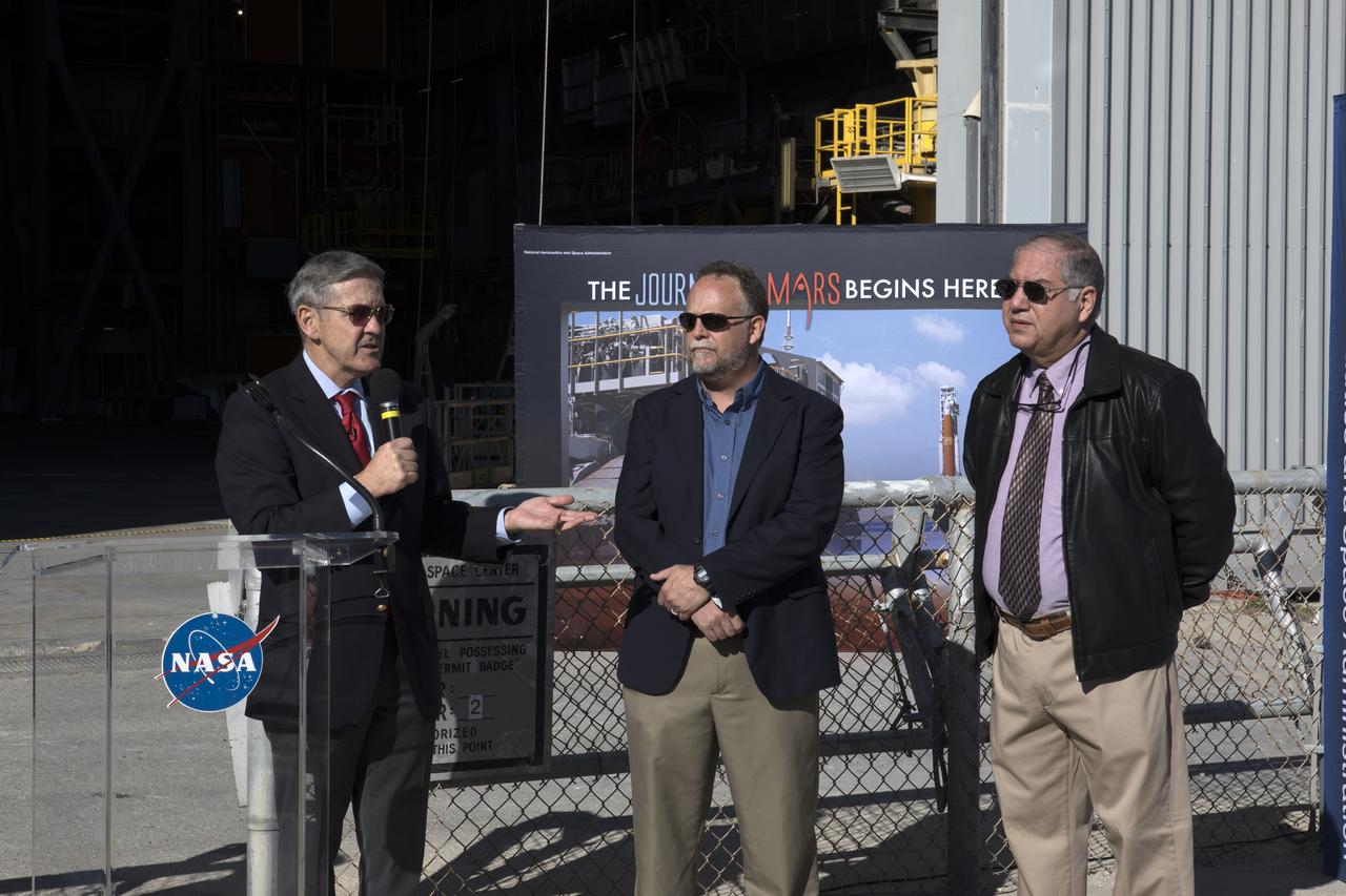 Members of the news media viewed the 10 levels of new work platforms in High Bay 3 inside the Vehicle Assembly Building during a multi-user tour of NASA's Kennedy Space Center in Florida with Center Director Bob Cabana. The final platform, A north, was recently installed. From left are Cabana; Shawn Quinn, associate program manager for the Ground Systems Development and Operations Program (GSDO); and Jose Perez-Morales, GSDO project manager for platform installation. The platforms will surround the Space Launch System and Orion spacecraft on the mobile launcher during processing to prepare for the first test flight.