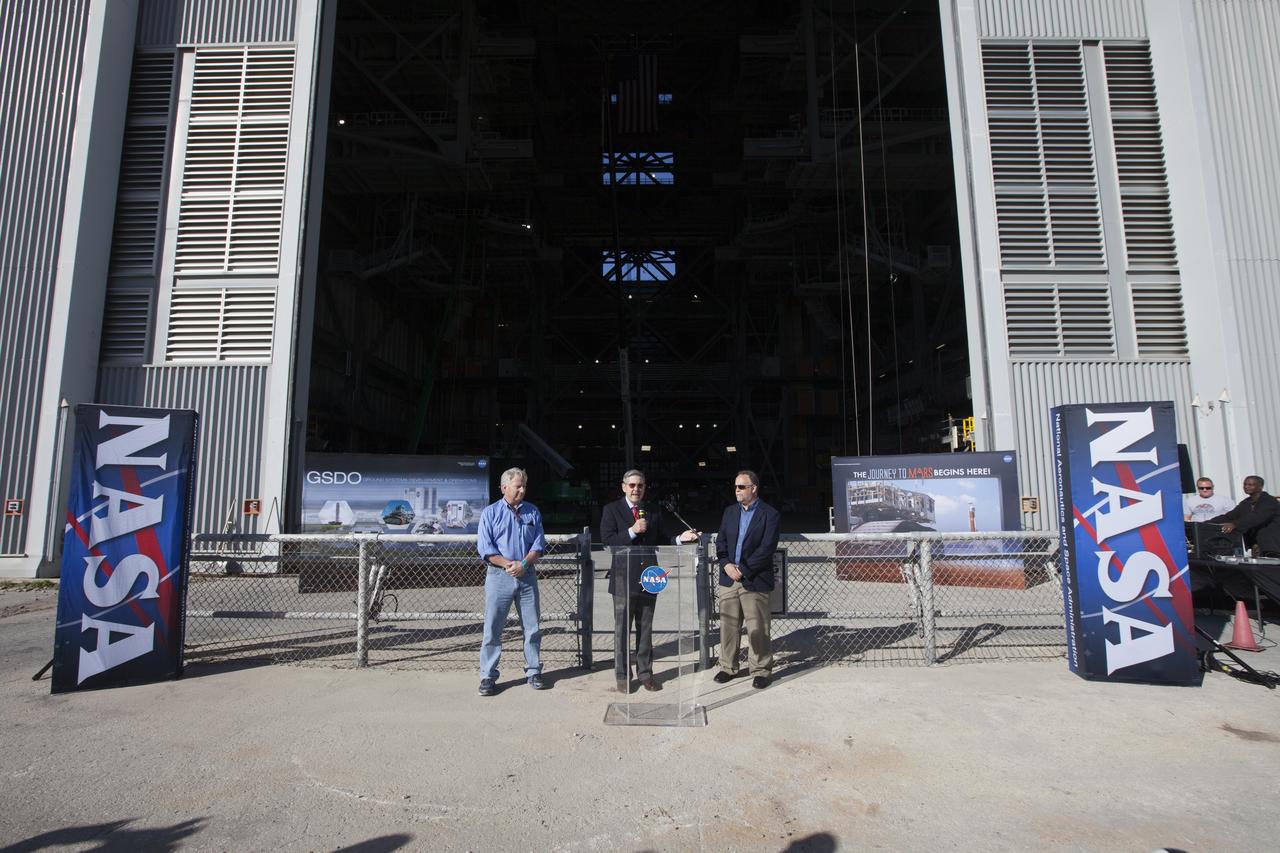 Members of the news media viewed the 10 levels of new work platforms in High Bay 3 inside the Vehicle Assembly Building during a multi-user tour of NASA's Kennedy Space Center in Florida with Center Director Bob Cabana. The final platform, A north, was recently installed. From left are Kerry Chreist of Jacobs on the Test and Operations Support Contract; Cabana; and Shawn Quinn, associate program manager for the Ground Systems Development and Operations Program. The platforms will surround the Space Launch System and Orion spacecraft on the mobile launcher during processing to prepare for the first test flight.