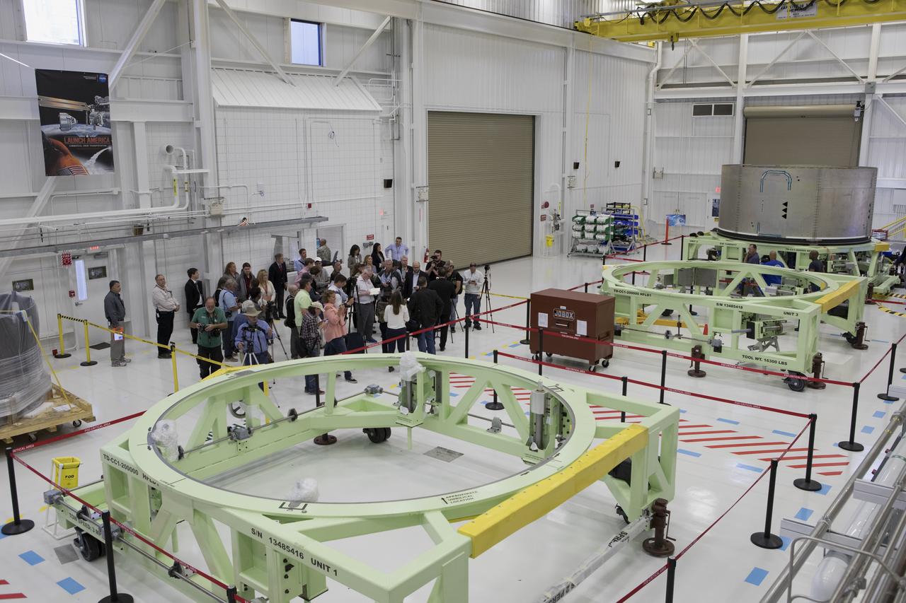 Inside Boeing’s Commercial Crew and Cargo Processing Facility at NASA's Kennedy Space Center in Florida members of the news media view work platforms that will be used in manufacturing Boeing's CST-100 Starliner spacecraft for flight tests and crew rotation missions to the International Space Station as part of the agency's Commercial Crew Program.