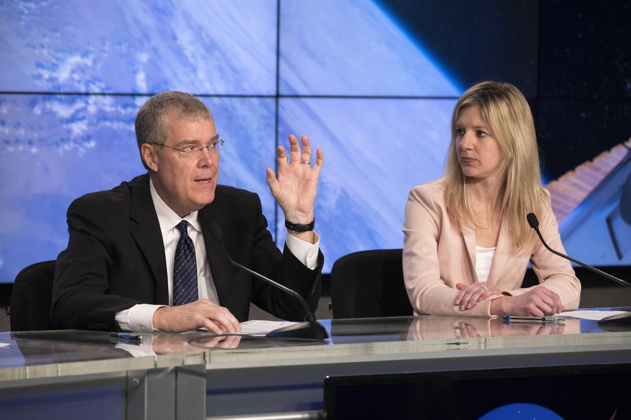 In the Kennedy Space Center’s Press Site auditorium, agency and industry leaders speak to members of the media at a prelaunch news conference for the SpaceX CRS-10 commercial resupply services mission to the International Space Station. From left are: Dan Hartman, deputy manager for the International Space Station Program at NASA's Johnson Space Center in Texas; and Jessica Jensen, director of Dragon mission management for SpaceX.