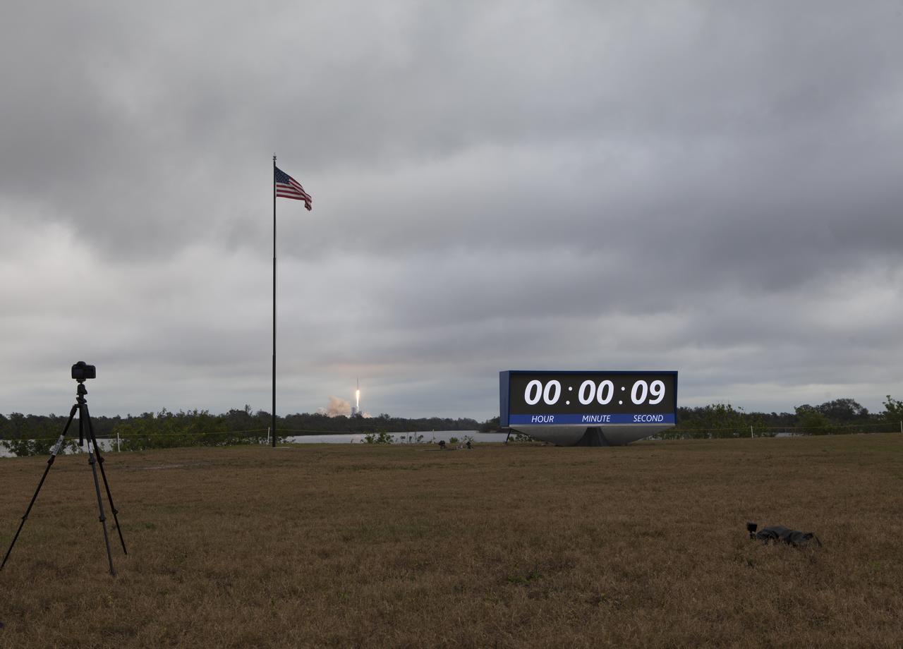 With the countdown clock at the NASA Kenney Space Center Press Site in the foreground, a SpaceX Falcon 9 rocket lifts off from Launch Complex 39A at the Florida spaceport. It was the company's 10th commercial resupply services mission to the International Space Station. Liftoff was at 9:39 a.m. EST from the historic launch site now operated by SpaceX under a property agreement with NASA. The Dragon spacecraft will deliver about 5,500 pounds of supplies, such as the Stratospheric Aerosol and Gas Experiment (SAGE) III instrument to further study ozone in the atmosphere.