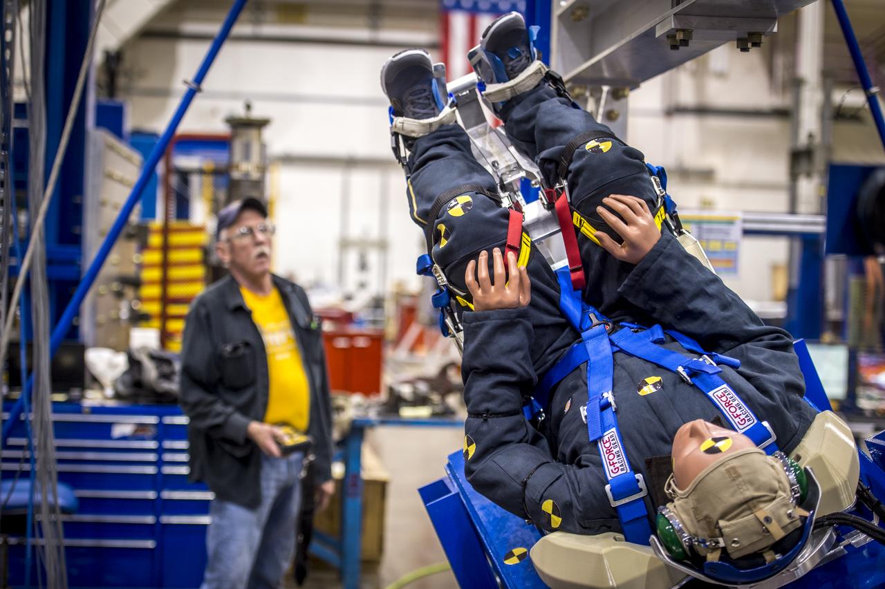 Engineers working with Boeing's CST-100 Starliner test the spacecraft's seat design in Mesa, Arizona, focusing on how the spacecraft seats would protect an astronaut's head, neck and spine during the 240-mile descent from the International Space Station. The company incorporated test dummies for a detailed analysis of impacts on a crew returning to earth. The human-sized dummies were equipped with sensitive instrumentation and secured in the seats for 30 drop tests at varying heights, angles, velocities and seat orientations in order to mimic actual landing conditions. High-speed cameras captured the footage for further analysis. The Starliner spacecraft is being developed in partnership with NASA's Commercial Crew Program.