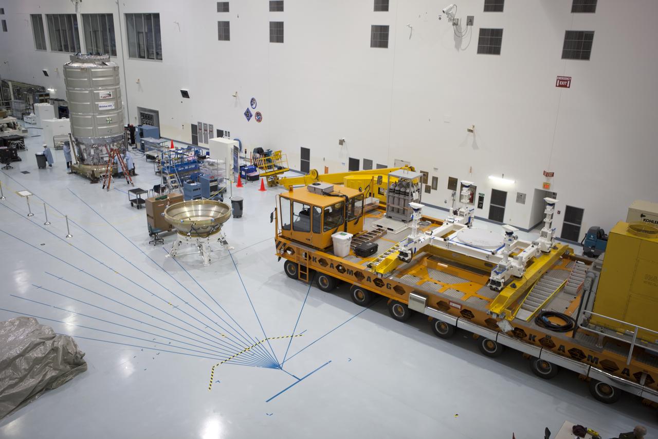 In the Space Station Processing Facility at NASA's Kennedy Space Center in Florida, a KAMAG transporter has arrived in the high bay. Technicians are preparing Orbital ATK's CYGNUS pressurized cargo module for bagging. The Orbital ATK CRS-7 commercial resupply services mission to the International Space Station is scheduled to launch atop a United Launch Alliance Atlas V rocket from Space Launch Complex 41 at Cape Canaveral Air Force Station on March 19, 2017. CYGNUS will deliver thousands of pounds of supplies, equipment and scientific research materials to the space station.