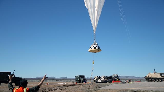A boilerplate CST-100 Starliner is lifted skyward by a balloon for a drop test of the Starliner's parachute system. Boeing, which is building the Starliner, conducted the test in White Sands, New Mexico, as part of the testing campaign for certification by NASA's Commercial Crew Program. Photo credit: Boeing