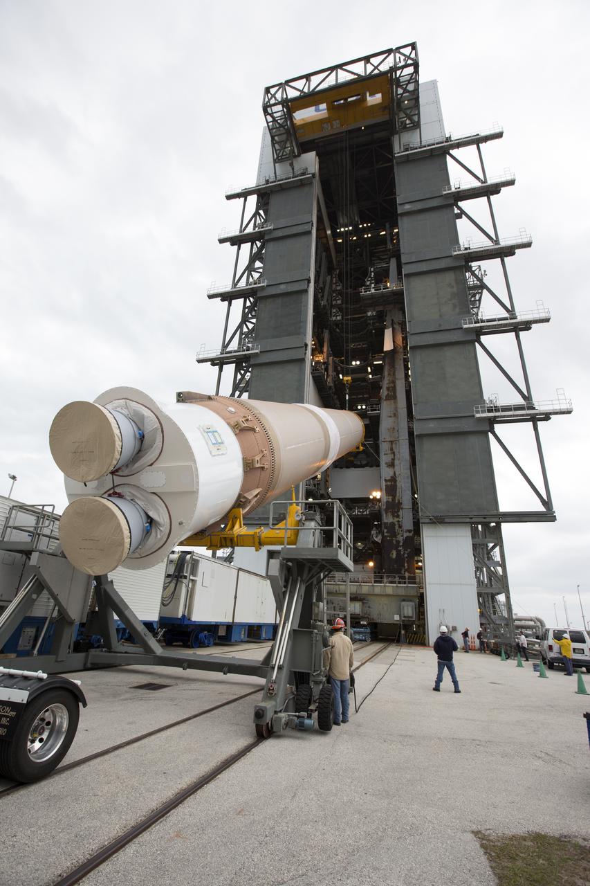 The first stage of the United Launch Alliance (ULA) Atlas V rocket is moved into the Vertical Integration Facility at Space Launch Complex 41 at Cape Canaveral Air Force Station in Florida. The rocket is being prepared for Orbital ATK's seventh commercial resupply mission, CRS-7, to the International Space Station. Orbital ATK's CYGNUS pressurized cargo module is scheduled to launch atop ULA's Atlas V rocket from Pad 41 on March 19, 2017. CYGNUS will deliver thousands of pounds of supplies, equipment and scientific research materials to the space station.