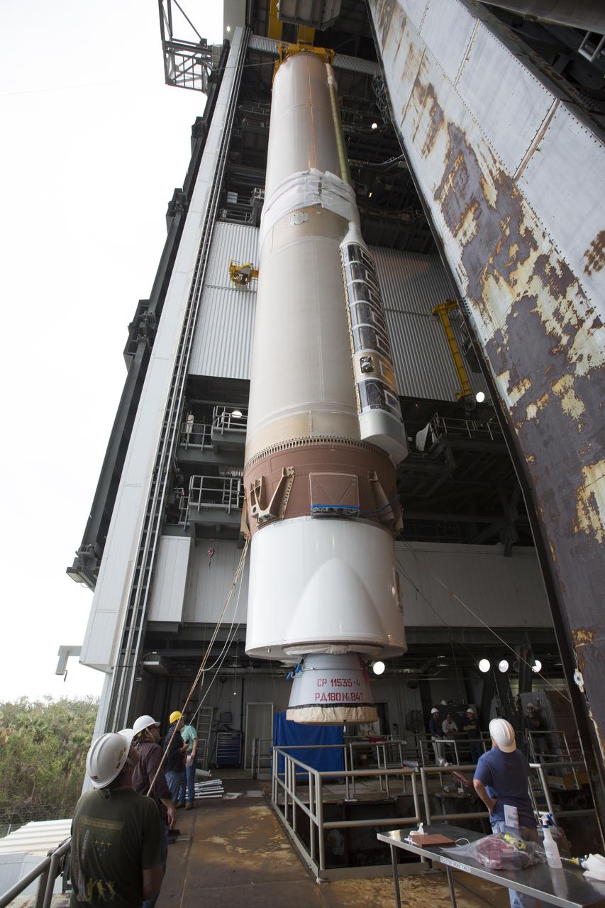 The first stage of the United Launch Alliance (ULA) Atlas V rocket is lifted up inside the Vertical Integration Facility at Space Launch Complex 41 at Cape Canaveral Air Force Station in Florida. The rocket is being prepared for Orbital ATK's seventh commercial resupply mission, CRS-7, to the International Space Station. Orbital ATK's CYGNUS pressurized cargo module is scheduled to launch atop ULA's Atlas V rocket from Pad 41 on March 19, 2017. CYGNUS will deliver thousands of pounds of supplies, equipment and scientific research materials to the space station.