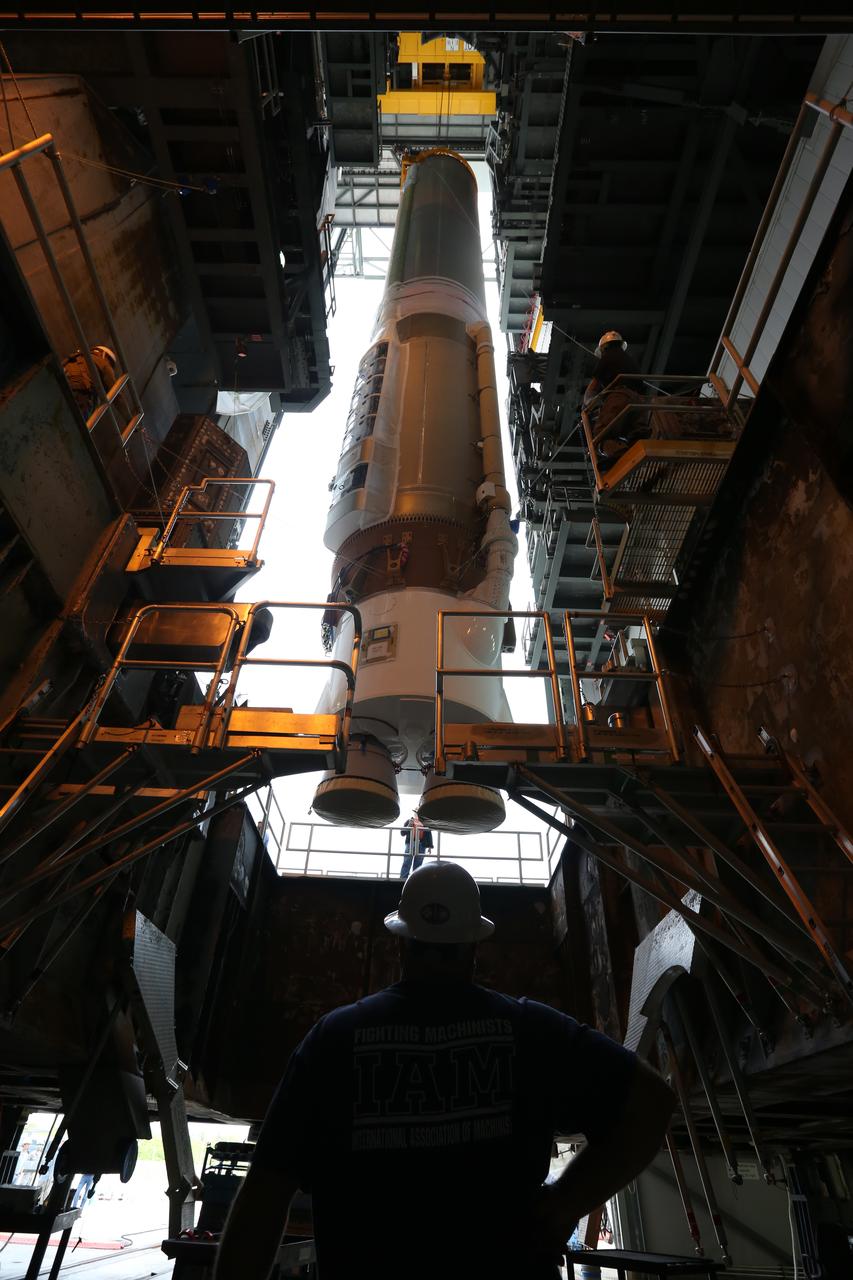 The first stage of the United Launch Alliance (ULA) Atlas V rocket is lifted up inside the Vertical Integration Facility at Space Launch Complex 41 at Cape Canaveral Air Force Station in Florida. The rocket is being prepared for Orbital ATK's seventh commercial resupply mission, CRS-7, to the International Space Station. Orbital ATK's CYGNUS pressurized cargo module is scheduled to launch atop ULA's Atlas V rocket from Pad 41 on March 19, 2017. CYGNUS will deliver thousands of pounds of supplies, equipment and scientific research materials to the space station.