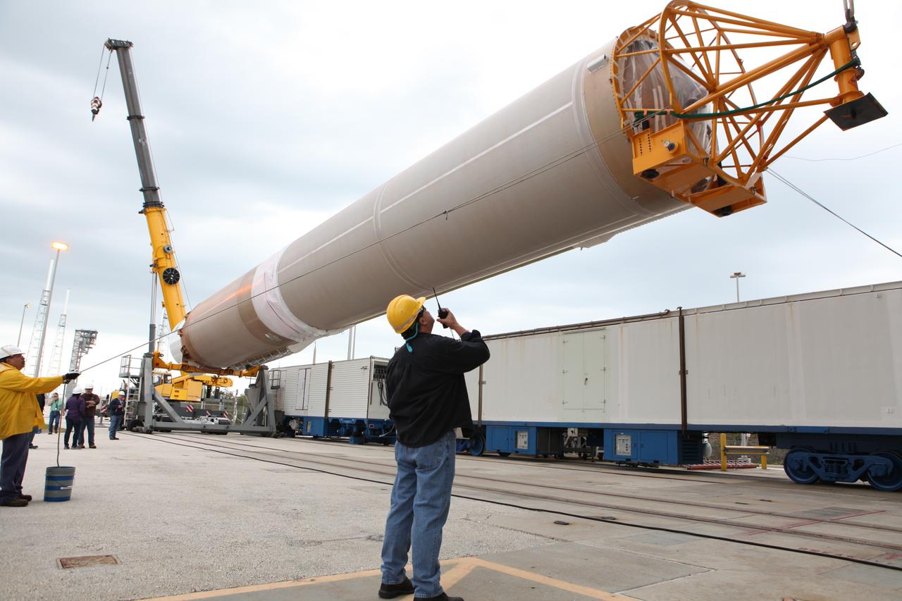 A crane is use to lift the first stage of the United Launch Alliance (ULA) Atlas V rocket and move it into the Vertical Integration Facility at Space Launch Complex 41 at Cape Canaveral Air Force Station in Florida. The rocket is being prepared for Orbital ATK's seventh commercial resupply mission, CRS-7, to the International Space Station. Orbital ATK's CYGNUS pressurized cargo module is scheduled to launch atop ULA's Atlas V rocket from Pad 41 on March 19, 2017. CYGNUS will deliver thousands of pounds of supplies, equipment and scientific research materials to the space station.