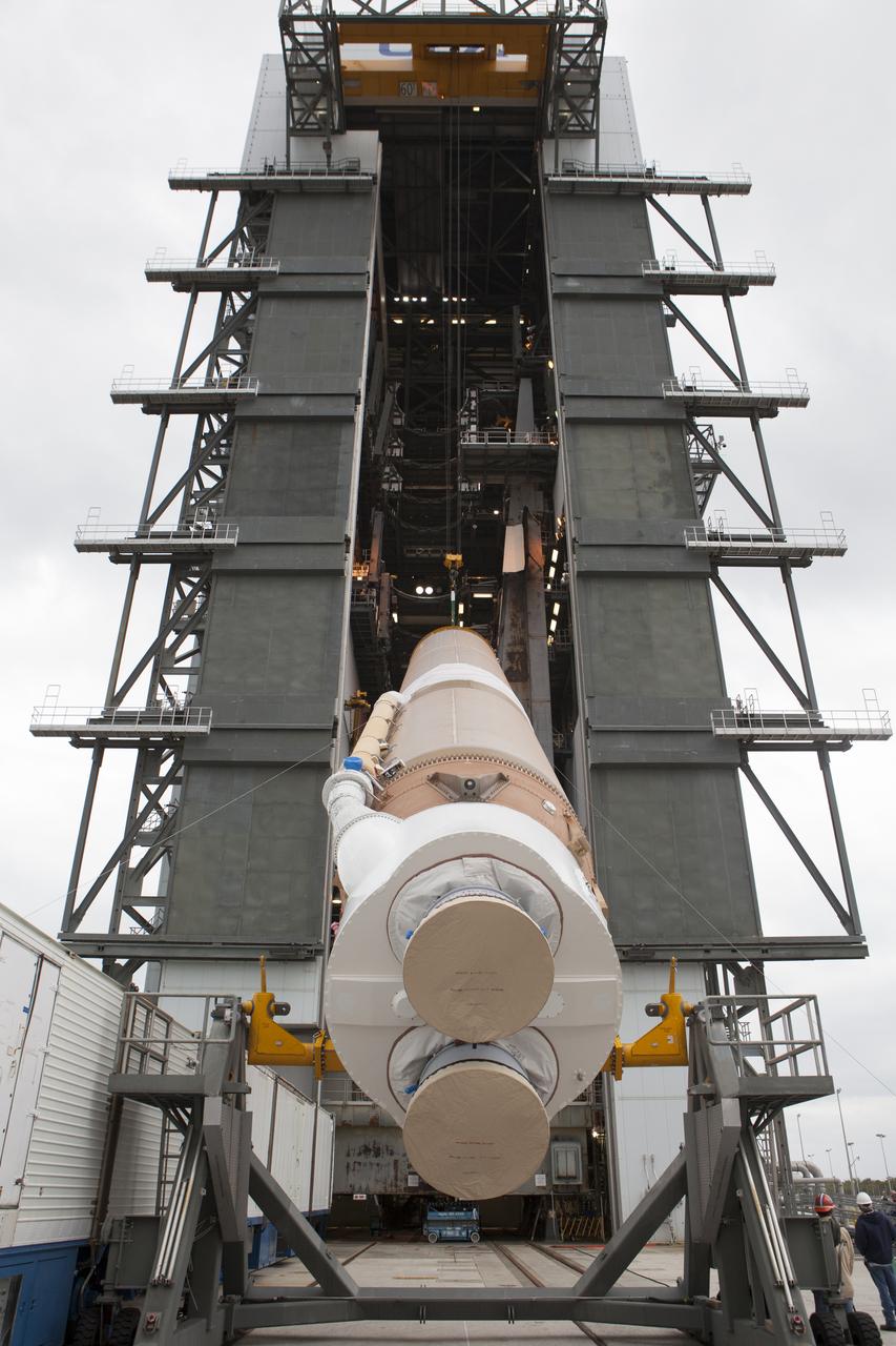 The first stage of the United Launch Alliance (ULA) Atlas V rocket is lifted by crane to vertical as it is moved into the Vertical Integration Facility at Space Launch Complex 41 at Cape Canaveral Air Force Station in Florida. The rocket is being prepared for Orbital ATK's seventh commercial resupply mission, CRS-7, to the International Space Station. Orbital ATK's CYGNUS pressurized cargo module is scheduled to launch atop ULA's Atlas V rocket from Pad 41 on March 19, 2017. CYGNUS will deliver thousands of pounds of supplies, equipment and scientific research materials to the space station.