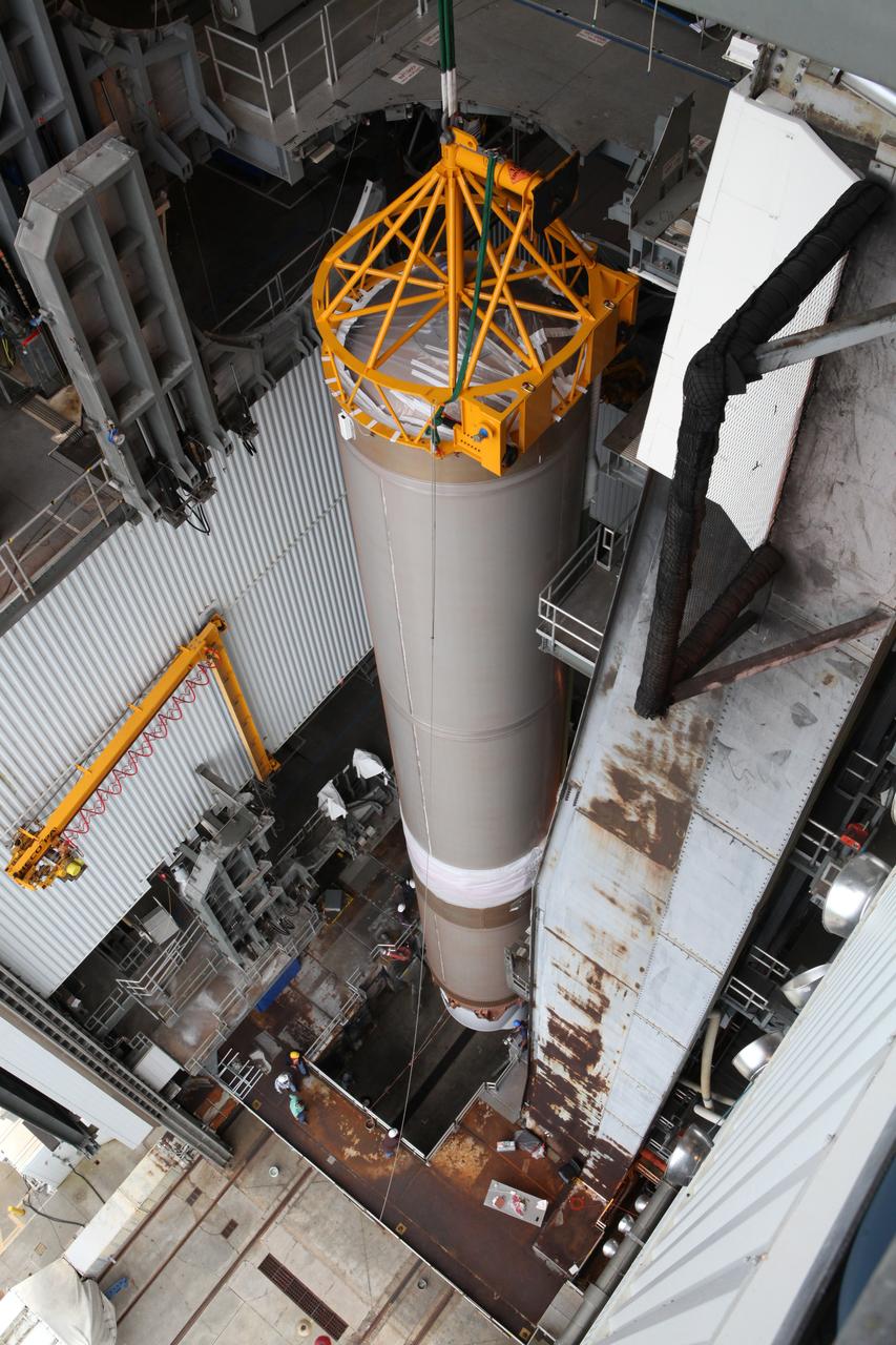 A view from above of the first stage of the United Launch Alliance (ULA) Atlas V rocket lifted to the vertical position inside the Vertical Integration Facility at Space Launch Complex 41 at Cape Canaveral Air Force Station in Florida. The rocket is being prepared for Orbital ATK's seventh commercial resupply mission, CRS-7, to the International Space Station. Orbital ATK's CYGNUS pressurized cargo module is scheduled to launch atop ULA's Atlas V rocket from Pad 41 on March 19, 2017. CYGNUS will deliver thousands of pounds of supplies, equipment and scientific research materials to the space station.