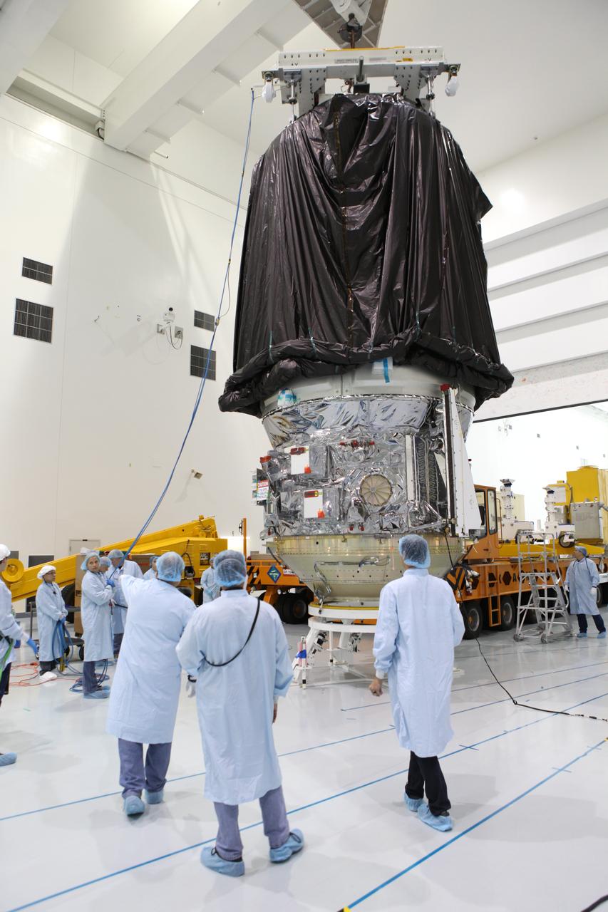 In the Space Station Processing Facility at NASA's Kennedy Space Center in Florida, technicians assist as a crane is used to lower a protective covering over Orbital ATK's CYGNUS pressurized cargo module. The module will be secured on a KAMAG transporter for the trip to the Payload Hazardous Servicing Facility. The Orbital ATK CRS-7 commercial resupply services mission to the International Space Station is scheduled to launch atop a United Launch Alliance Atlas V rocket from Space Launch Complex 41 at Cape Canaveral Air Force Station on March 19, 2017. CYGNUS will deliver thousands of pounds of supplies, equipment and scientific research materials to the space station. 