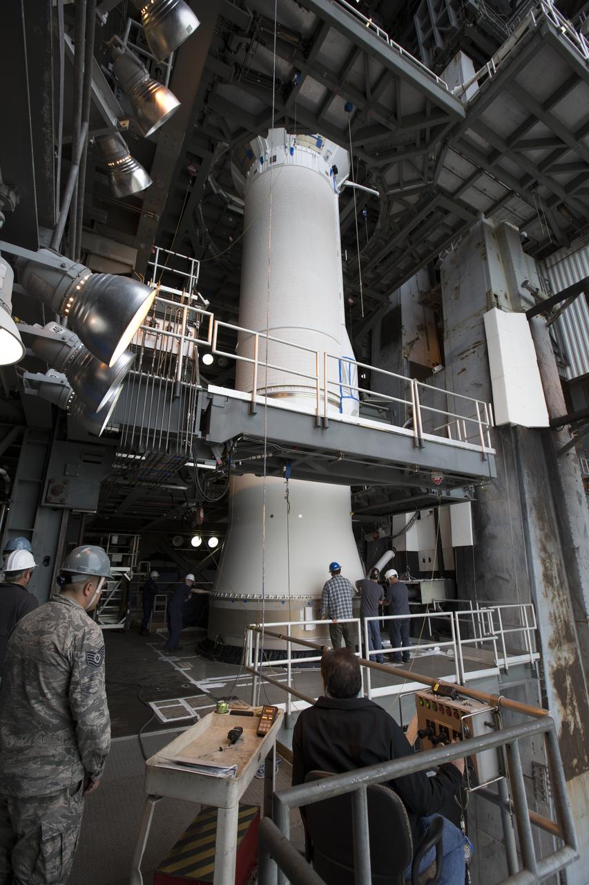 Technicians with United Launch Alliance (ULA) assist as the Centaur upper stage of the ULA Atlas V rocket is lowered onto the first stage booster inside the Vertical Integration Facility at Space Launch Complex 41 at Cape Canaveral Air Force Station in Florida. The rocket is being prepared for Orbital ATK's seventh commercial resupply mission, CRS-7, to the International Space Station. Orbital ATK's CYGNUS pressurized cargo module is scheduled to launch atop ULA's Atlas V rocket from Pad 41 on March 19, 2017. CYGNUS will deliver 7,600 pounds of supplies, equipment and scientific research materials to the space station.