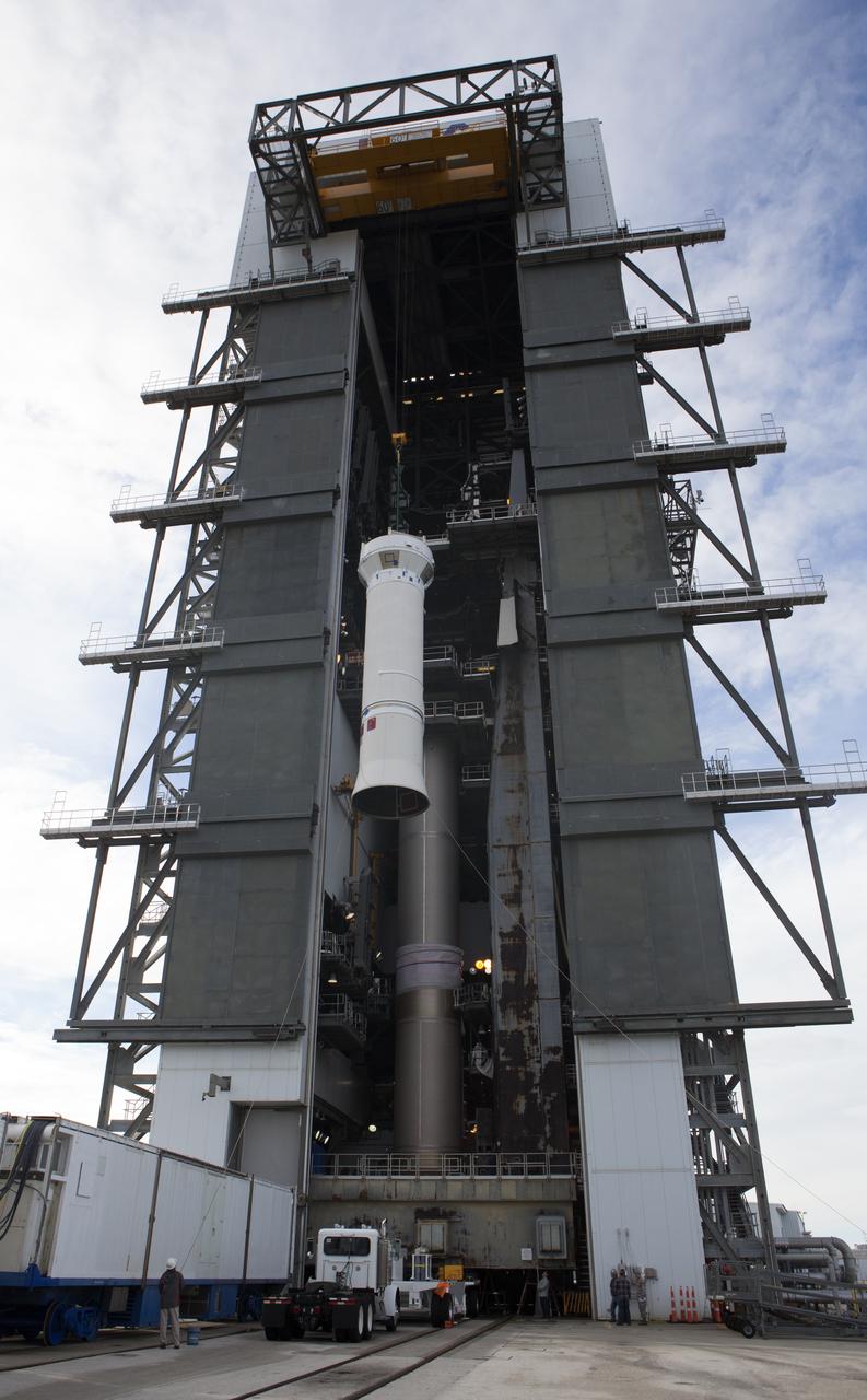 The Centaur upper stage of the United Launch Alliance (ULA) Atlas V rocket is lifted up by crane at the Vertical Integration Facility at Space Launch Complex 41 at Cape Canaveral Air Force Station in Florida. The Centaur stage will be lifted inside the VIF and lowered for mating to the first stage booster. The rocket is being prepared for Orbital ATK's seventh commercial resupply mission, CRS-7, to the International Space Station. Orbital ATK's CYGNUS pressurized cargo module is scheduled to launch atop ULA's Atlas V rocket from Pad 41 on March 19, 2017. CYGNUS will deliver 7,600 pounds of supplies, equipment and scientific research materials to the space station.