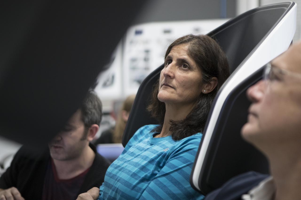 During a tour of SpaceX headquarters in Hawthorne, California, commercial crew astronauts Suni Williams, left, and Doug Hurley participate in joint test team training using mockup components of the Crew Dragon on Feb. 23, 2017. Crew Dragon is being developed and manufactured in partnership with NASA's Commercial Crew Program to return human spaceflight capabilities to the U.S.