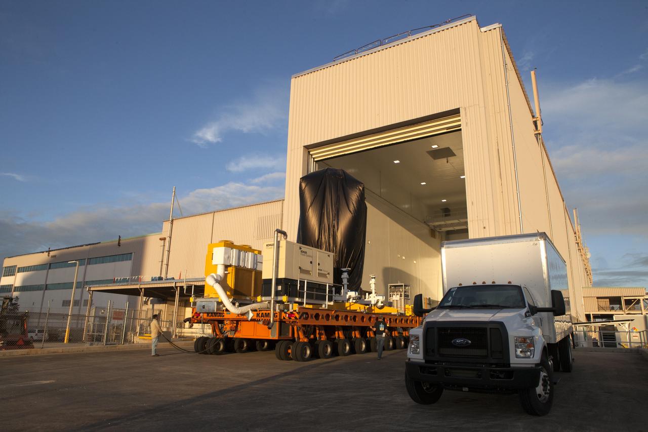 A KAMAG transporter with Orbital ATK's CYGNUS pressurized cargo module secured on top exits the Space Station Processing Facility at NASA's Kennedy Space Center in Florida. CYGNUS will be transported to the Payload Hazardous Servicing Facility for final propellant loading and late cargo stowage. The Orbital ATK CRS-7 commercial resupply services mission to the International Space Station is scheduled to launch atop a United Launch Alliance Atlas V rocket from Space Launch Complex 41 at Cape Canaveral Air Force Station on March 19, 2017. CYGNUS will deliver thousands of pounds of supplies, equipment and scientific research materials to the space station. 