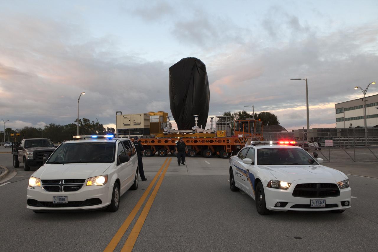 A KAMAG transporter with Orbital ATK's CYGNUS pressurized cargo module secured on top departs the Space Station Processing Facility at NASA's Kennedy Space Center in Florida. CYGNUS will be transported to the Payload Hazardous Servicing Facility for final propellant loading and late cargo stowage. The Orbital ATK CRS-7 commercial resupply services mission to the International Space Station is scheduled to launch atop a United Launch Alliance Atlas V rocket from Space Launch Complex 41 at Cape Canaveral Air Force Station on March 19, 2017. CYGNUS will deliver thousands of pounds of supplies, equipment and scientific research materials to the space station.