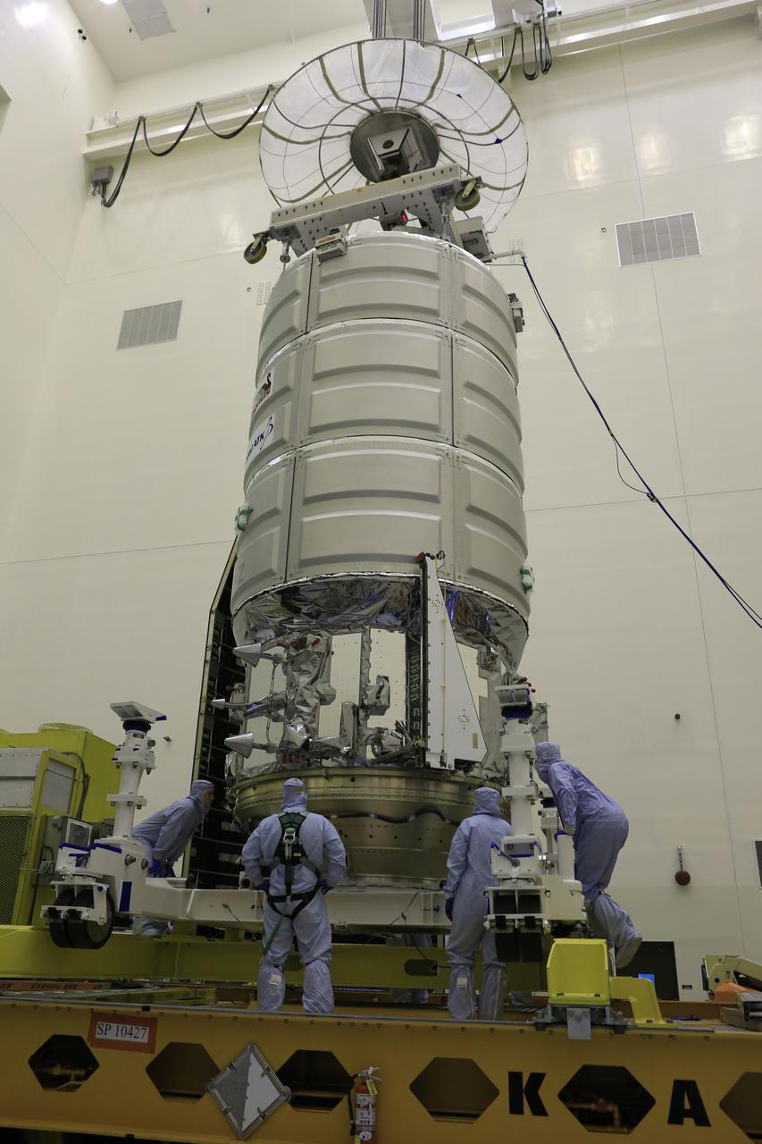 A crane is attached to Orbital ATK's CYGNUS pressurized cargo module to lift it up from the KAMAG transporter inside the Payload Hazardous Servicing Facility at NASA's Kennedy Space Center in Florida. CYGNUS will be lowered onto a work stand for final propellant loading and late cargo stowage. The Orbital ATK CRS-7 commercial resupply services mission to the International Space Station is scheduled to launch atop a United Launch Alliance Atlas V rocket from Space Launch Complex 41 at Cape Canaveral Air Force Station on March 19, 2017. CYGNUS will deliver thousands of pounds of supplies, equipment and scientific research materials to the space station. 